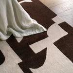 The hand-tufted Anthem Noverre makes a bold statement with contemporary aesthetics and modern Brutalist influences. The Noverre design stands out with its striking high-low texture, plush feel, and subtle sheen that enhances its dynamic pattern. Amethyst Home provides interior design, new home construction design consulting, vintage area rugs, and lighting in the Dallas metro area.
