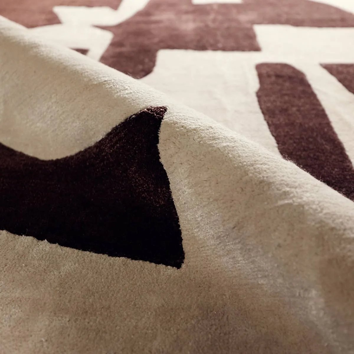 The hand-tufted Anthem Noverre makes a bold statement with contemporary aesthetics and modern Brutalist influences. The Noverre design stands out with its striking high-low texture, plush feel, and subtle sheen that enhances its dynamic pattern. Amethyst Home provides interior design, new home construction design consulting, vintage area rugs, and lighting in the Park City metro area.
