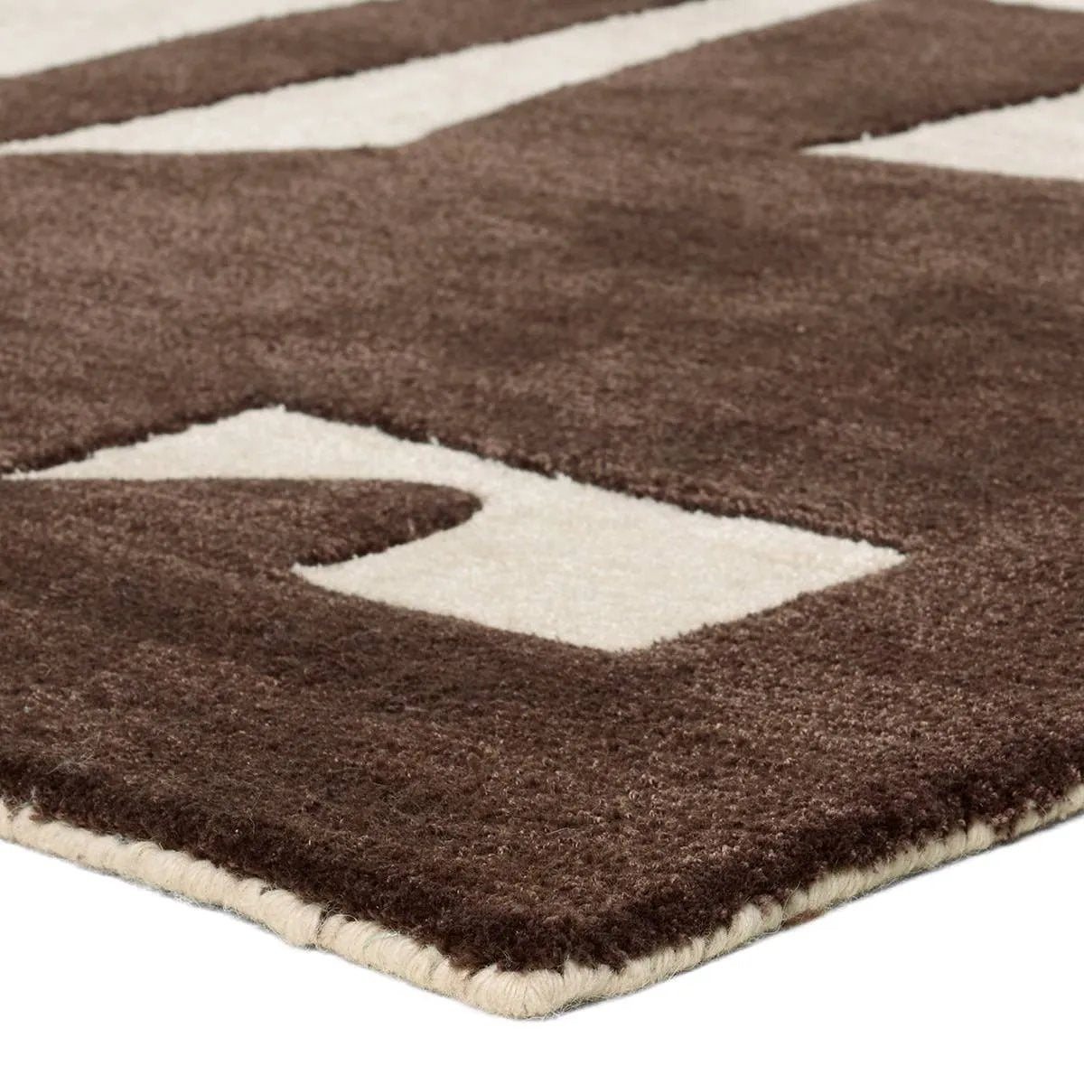 The hand-tufted Anthem Noverre makes a bold statement with contemporary aesthetics and modern Brutalist influences. The Noverre design stands out with its striking high-low texture, plush feel, and subtle sheen that enhances its dynamic pattern. Amethyst Home provides interior design, new home construction design consulting, vintage area rugs, and lighting in the Portland metro area.