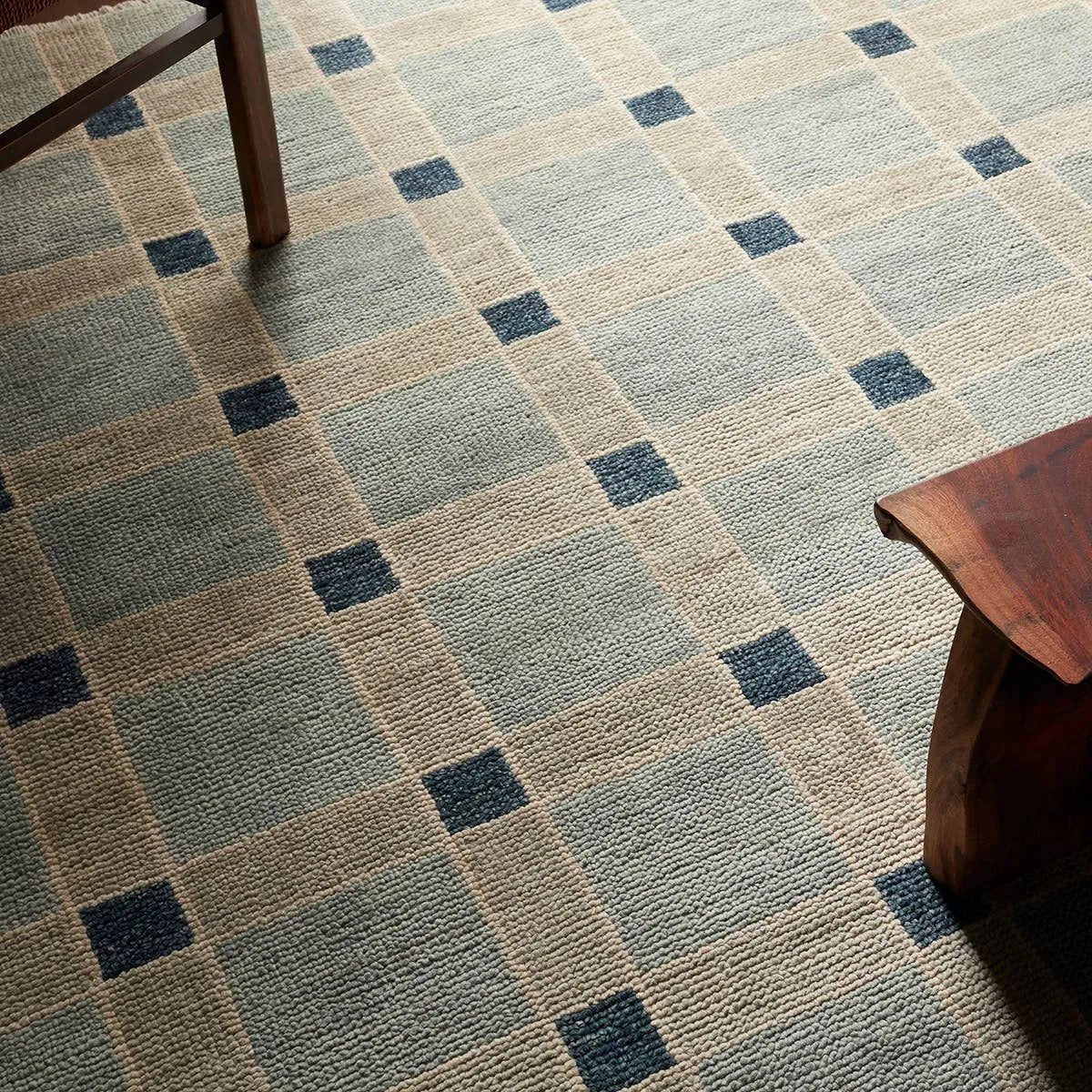 The Quinlan design reinvents timeless geometric patterns, fusing classic charm with a modern edge. Soft beige tones, punctuated by a blue accent, elevate any mid-century modern space. Handcrafted from naturally stain-resistant wool, this rug handles medium-traffic areas, kids, and pets with ease. Amethyst Home provides interior design, new home construction design consulting, vintage area rugs, and lighting in the Newport Beach metro area.