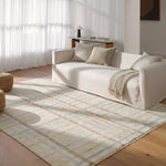 The Raza design reinvents the timeless plaid pattern, fusing classic charm with a modern edge. Soft beige tones, punctuated by a blue accent, elevate any mid-century modern space. Handcrafted from naturally stain-resistant wool, this rug handles medium-traffic areas, kids, and pets with ease. Amethyst Home provides interior design, new home construction design consulting, vintage area rugs, and lighting in the Houston metro area.