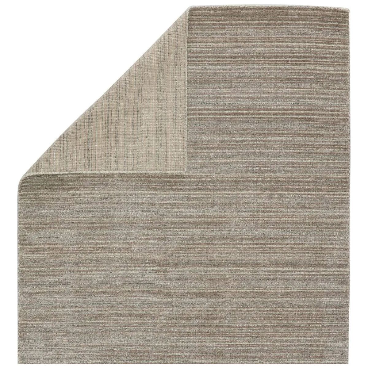 Featuring Second Sunset  Gradient Rug by Jaipur Living at Amethyst Home. The easy-to-decorate, earthy tones of the Second Sunset Gradient prove that simplicity can sometimes be striking. The Gradient rug is hand loomed of durable wool and jasmine for a sumptuous and inviting hand. The variation in the cool brown, gray, and light taupe tones of this lust. Amethyst Home provides interior design, new home construction design consulting, vintage area rugs, and lighting in the Winter Garden metro area.