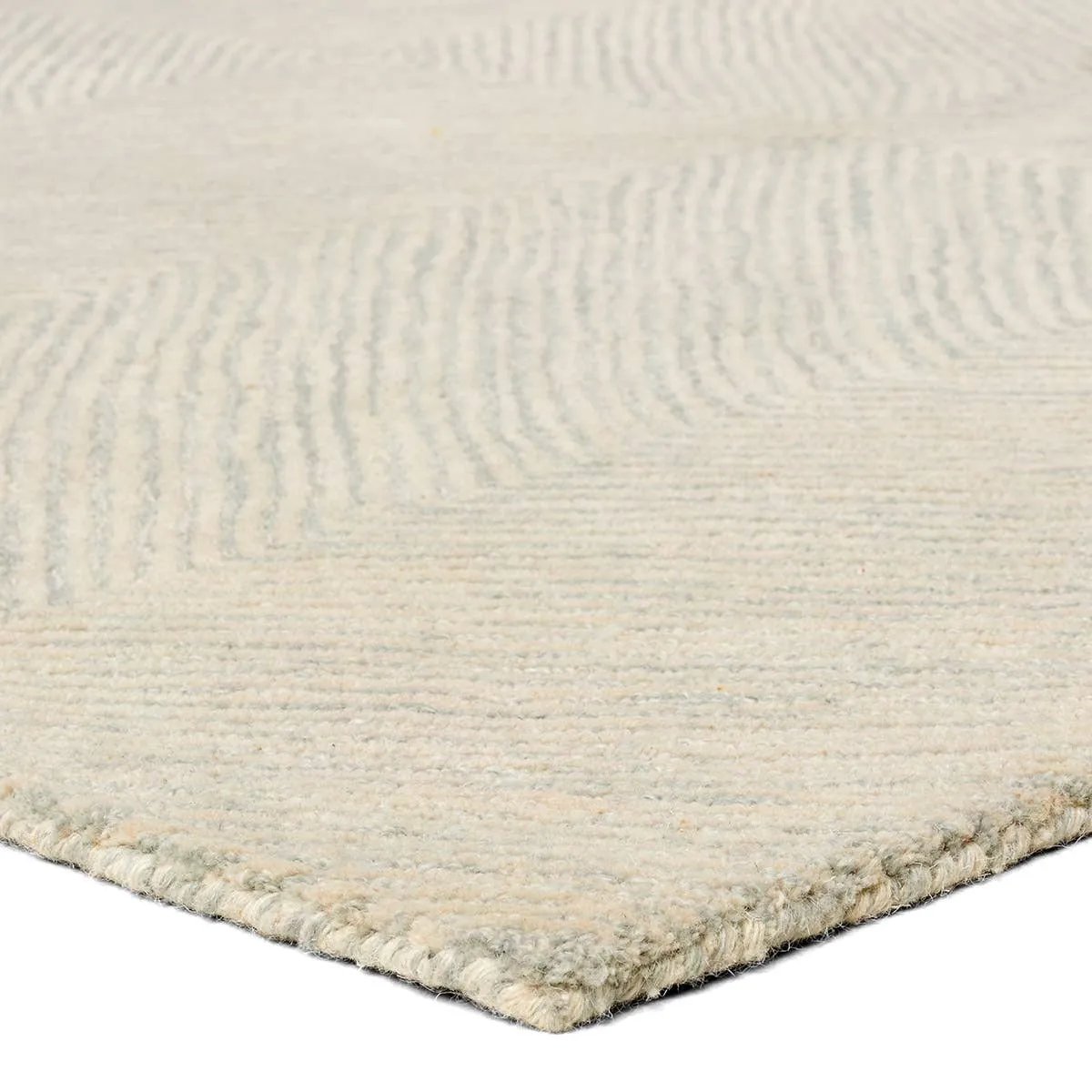 The handtufted Labyrinth Collection features abstract designs crafted from plush wool with a cut-and-looped pile, creating a rich, tactile texture. The Tulsi design showcases a bold, geometric pattern with modern Brutalist influence in varying shades of gray and taupe, adding depth and sophistication with its subtle tonal dimension.Hand Tufte Amethyst Home provides interior design, new home construction design consulting, vintage area rugs, and lighting in the Kansas City metro area.