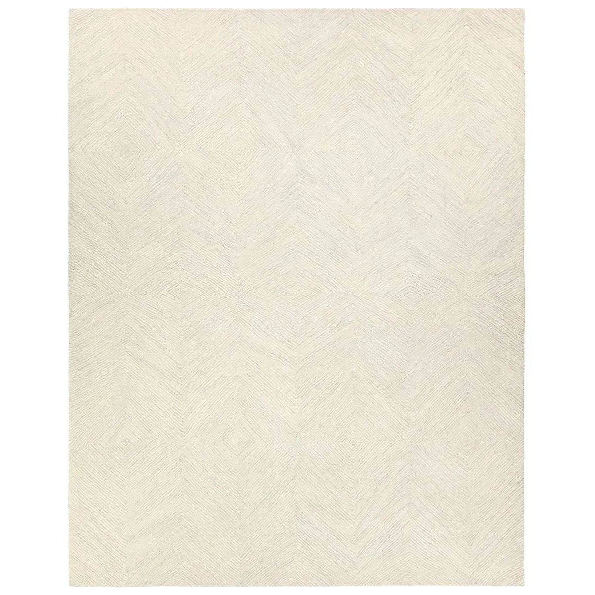 The handtufted Labyrinth Collection features abstract designs crafted from plush wool with a cut-and-looped pile, creating a rich, tactile texture. The Tulsi design showcases a bold, geometric pattern with modern Brutalist influence in varying shades of gray and taupe, adding depth and sophistication with its subtle tonal dimension.Hand Tufte Amethyst Home provides interior design, new home construction design consulting, vintage area rugs, and lighting in the Salt Lake City metro area.
