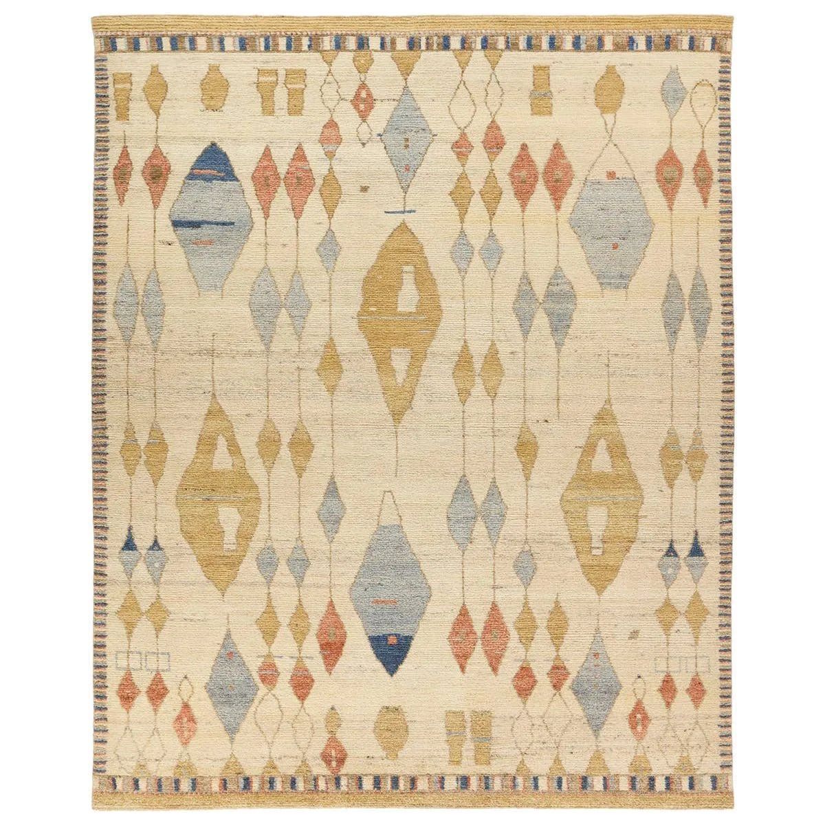 Enrich living spaces with the exotic allure of the Zaira Collection - a fusion of modern Moroccan designs and unparalleled craftsmanship. Handknotted in India with 22 knots per square inch, these rugs exude luxury and artistry. The Tonnara rug showcases an intriguing diamond pattern in beige, yellow, blue, and rust hues. Amethyst Home provides interior design, new home construction design consulting, vintage area rugs, and lighting in the Winter Garden metro area.