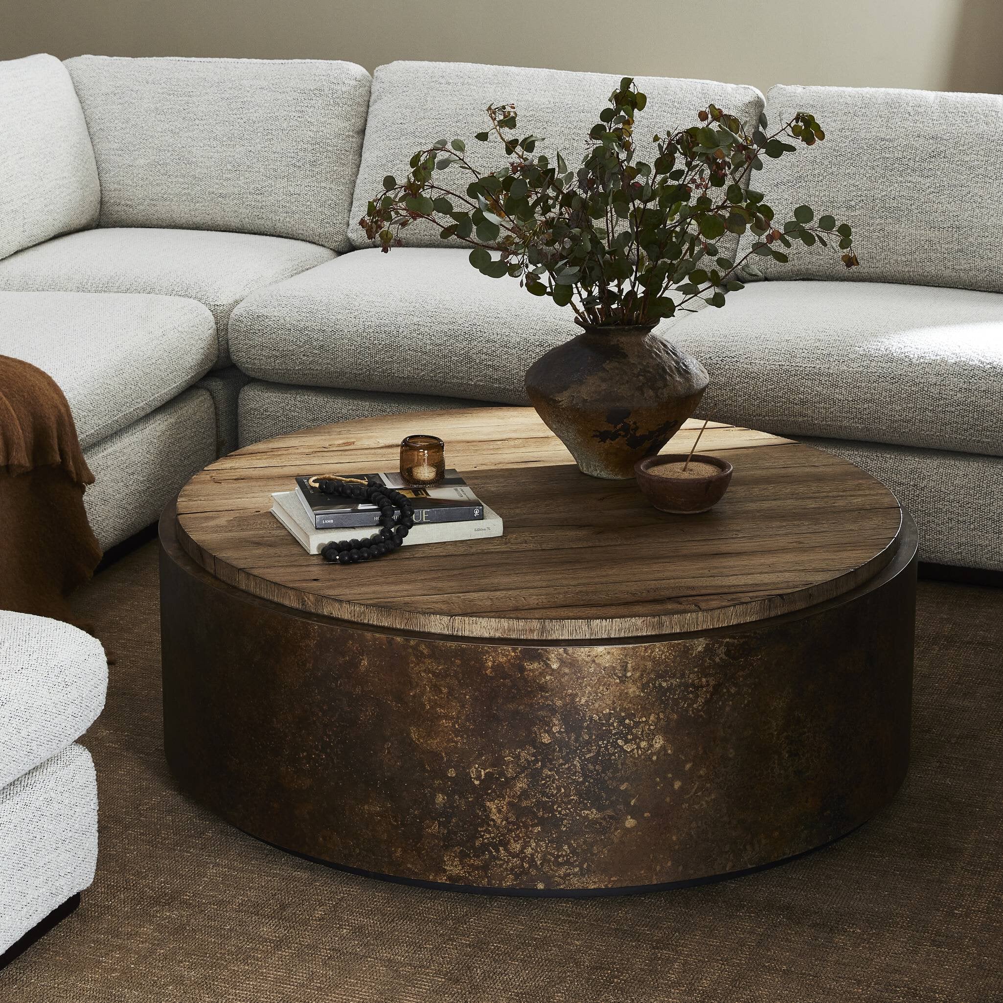 Featuring Kipp Burnt Bleached Oak Resawn Coffee Table by Four Hands at Amethyst Home. A drum-style table is wrapped in distressed aluminum with a rust finish, for a unique acid-wash effect. Topped with resawn oak which has been sun-bleached and torch-burned for both texture and character.Overall Dimensions: 47.50"w x 47.50"d x 16.00"hWeight : 136.69 lbsMaterials : Resawn Oak, Sol. Amethyst Home provides interior design, new construction, custom furniture, and area rugs in the Alpharetta metro area