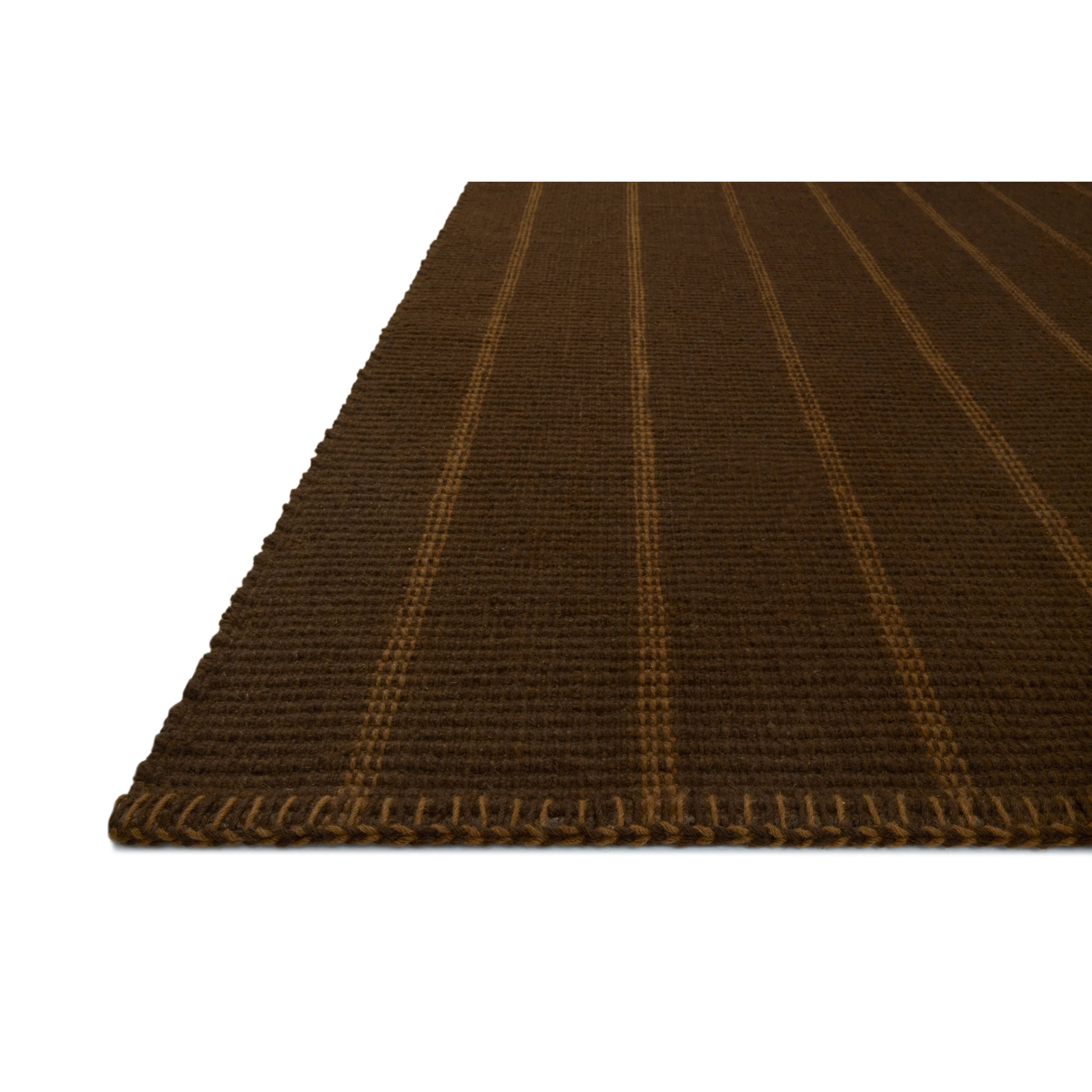 The Harlan Collection by Amber Lewis x Loloi is a classic striped flatweave area rug in the interior designer’s signature warm, earthy tones. The rug has a chunky wool pile with whipstitch borders that add character and natural texture to living rooms, bedrooms, and other well-loved areas of the home. Amethyst Home provides interior design, new home construction design consulting, vintage area rugs, and lighting in the Kansas City metro area.