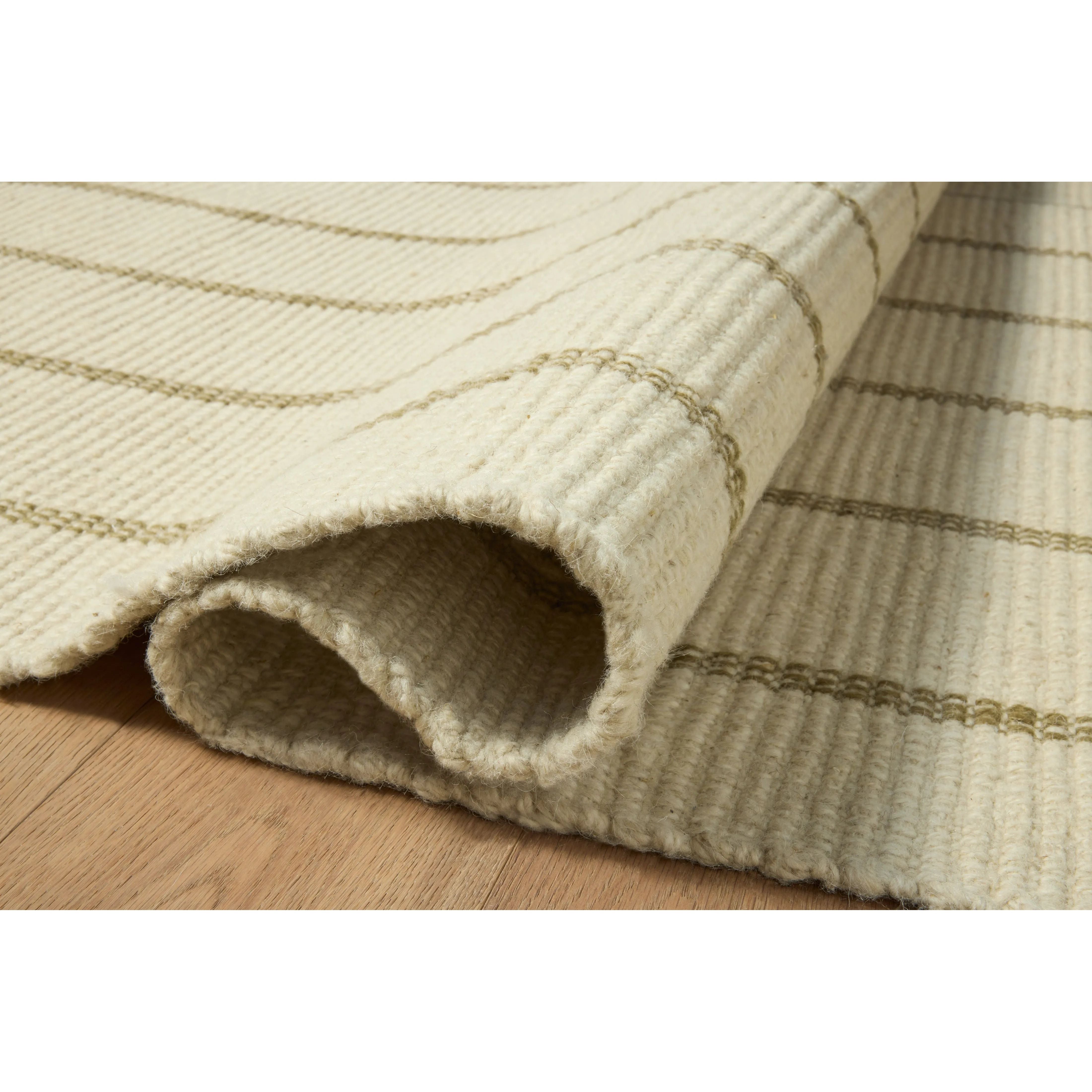 The Harlan Collection by Amber Lewis x Loloi is a classic striped flatweave area rug in the interior designer’s signature warm, earthy tones. The rug has a chunky wool pile with whipstitch borders that add character and natural texture to living rooms, bedrooms, and other well-loved areas of the home. Amethyst Home provides interior design, new home construction design consulting, vintage area rugs, and lighting in the Scottsdale metro area.