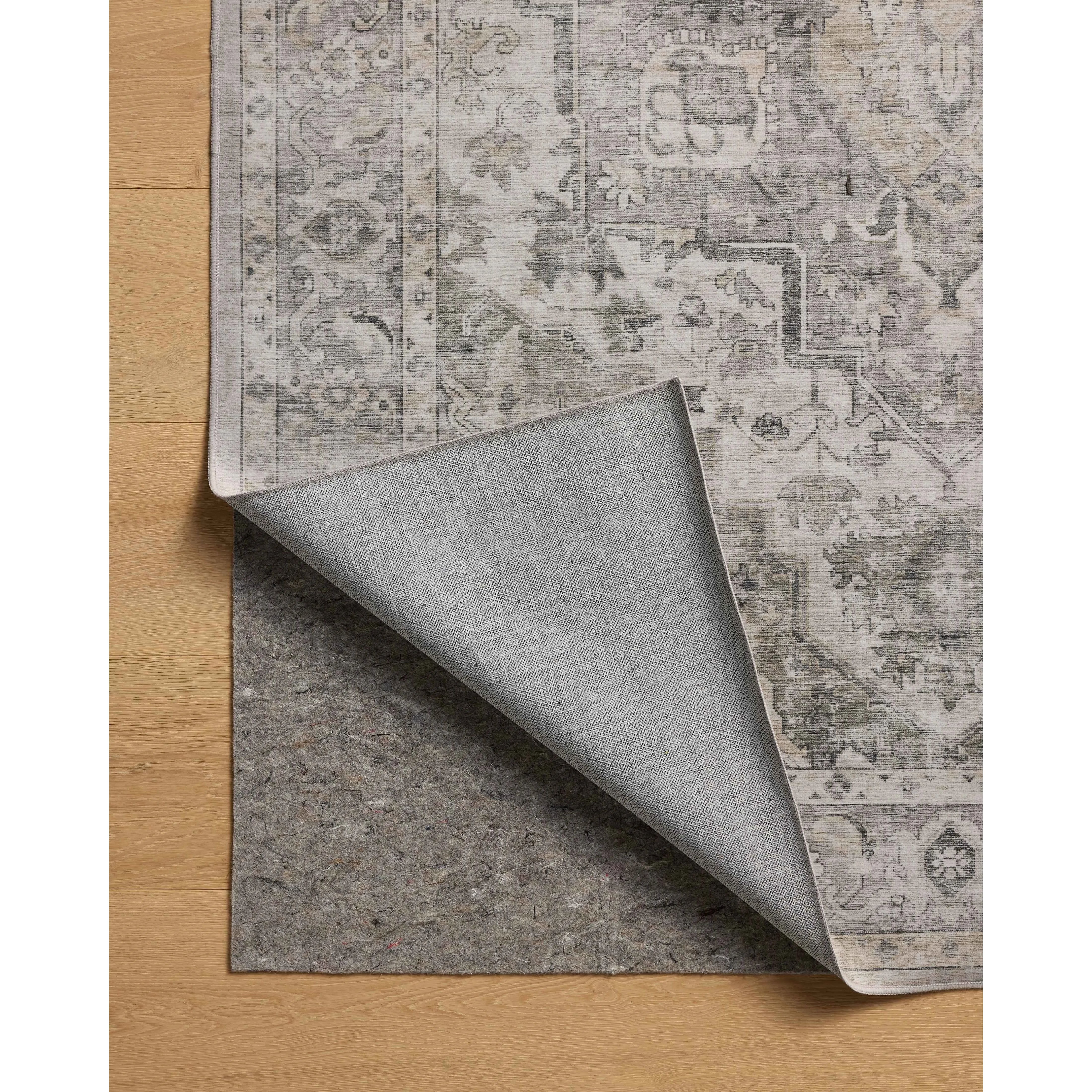 Featuring Amber Lewis x Loloi Josie Silver / Natural Rug by Loloi at Amethyst Home. The Josie Collection is a machine-washable area rug with an exceptional design by Amber Lewis x Loloi. The rugs beautiful, vintage-inspired motifs in rich, earthy tones raise the standard for washable rugs. This collection is power-loomed of polyester in China and OEKO-TEX. Amethyst Home provides interior design, new home construction design consulting, vintage area rugs, and lighting in the Los Angeles metro area.