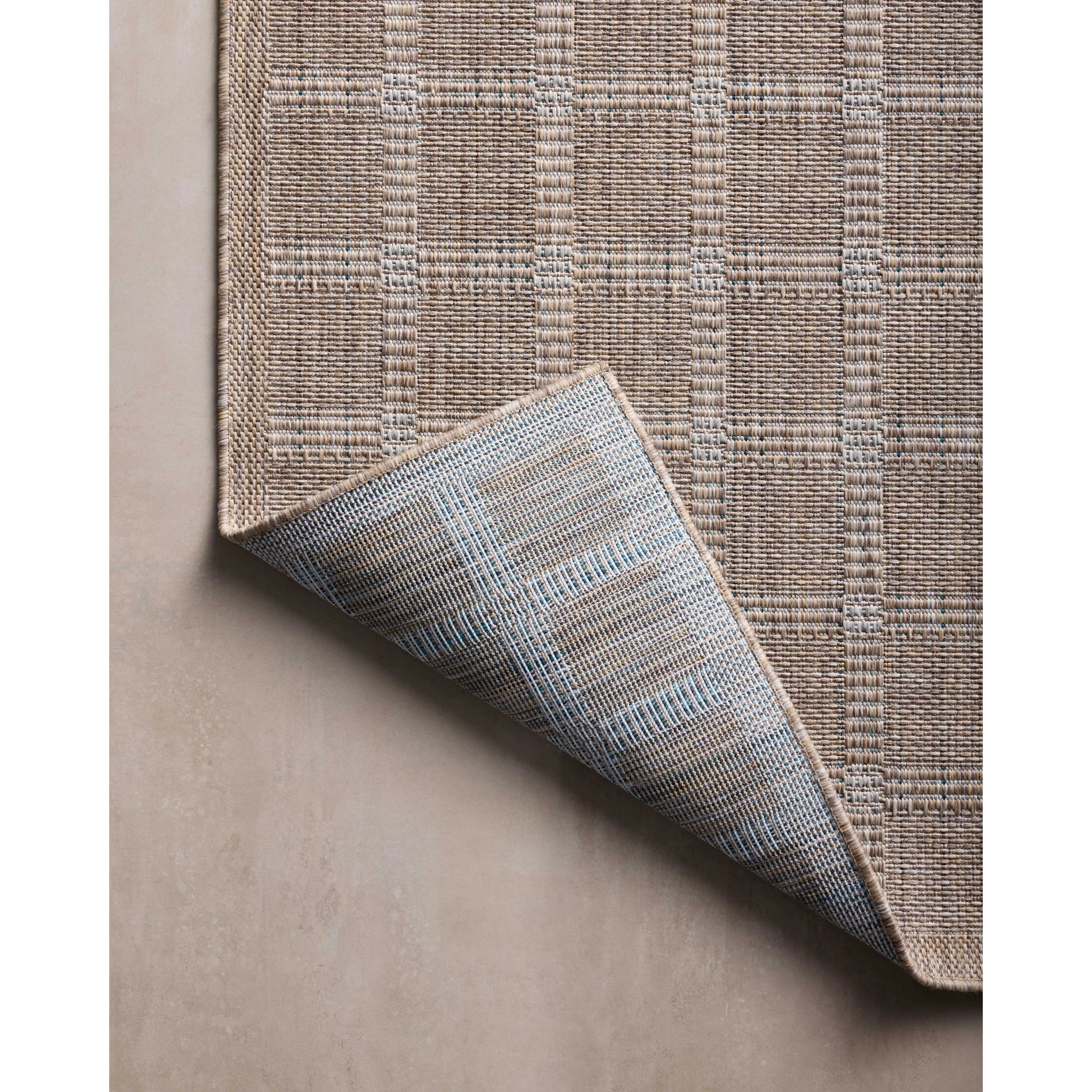 Inspired by the scenic mountain town in California, the Topanga Collection is an indoor/outdoor rug made of durable polypropylene that resembles natural fibers but is much more ready for sun, rain, and high-traffic use. Amethyst Home provides interior design, new home construction design consulting, vintage area rugs, and lighting in the Austin metro area.