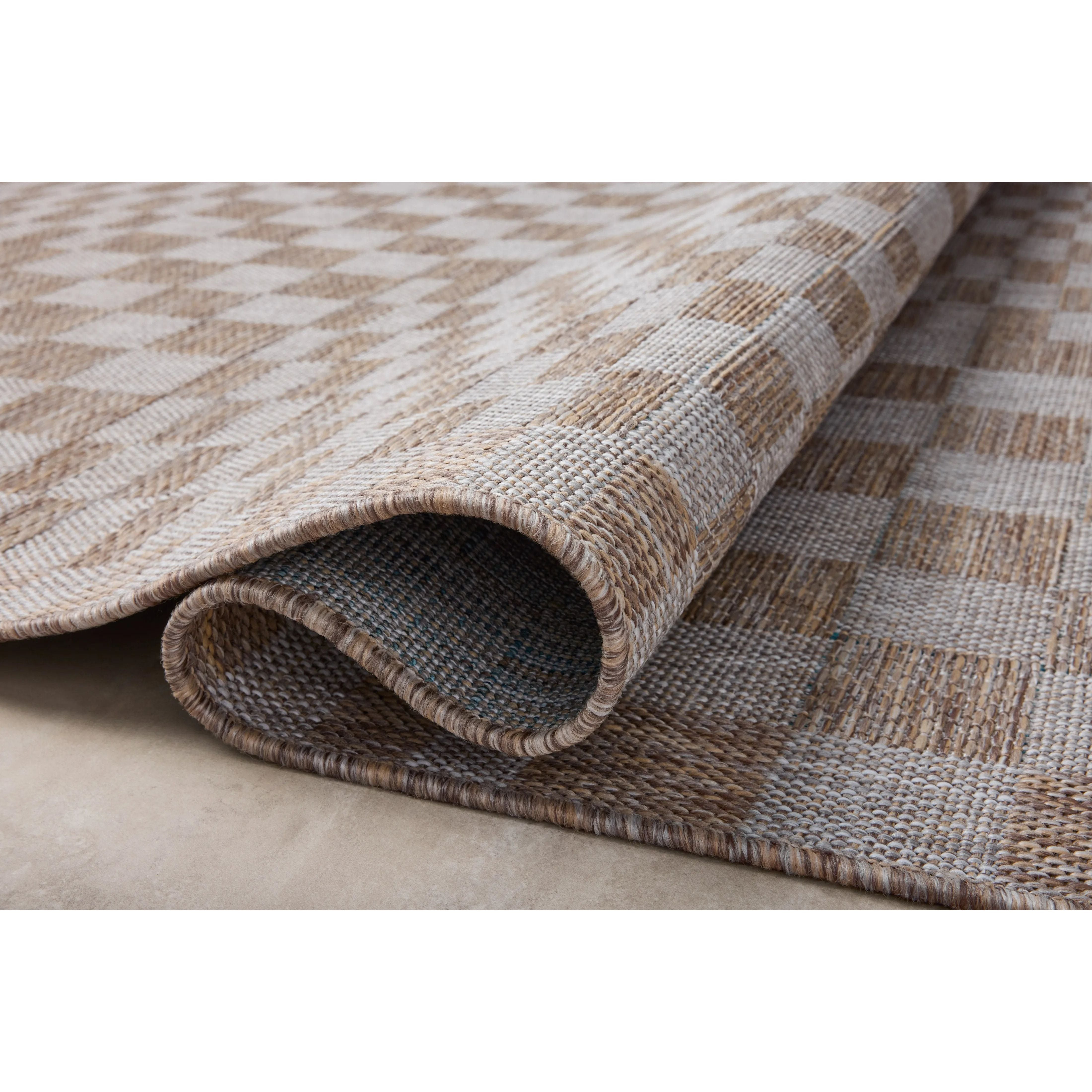 Inspired by the scenic mountain town in California, the Topanga Collection is an indoor/outdoor rug made of durable polypropylene that resembles natural fibers but is much more ready for sun, rain, and high-traffic use. Amethyst Home provides interior design, new home construction design consulting, vintage area rugs, and lighting in the Laguna Beach metro area.