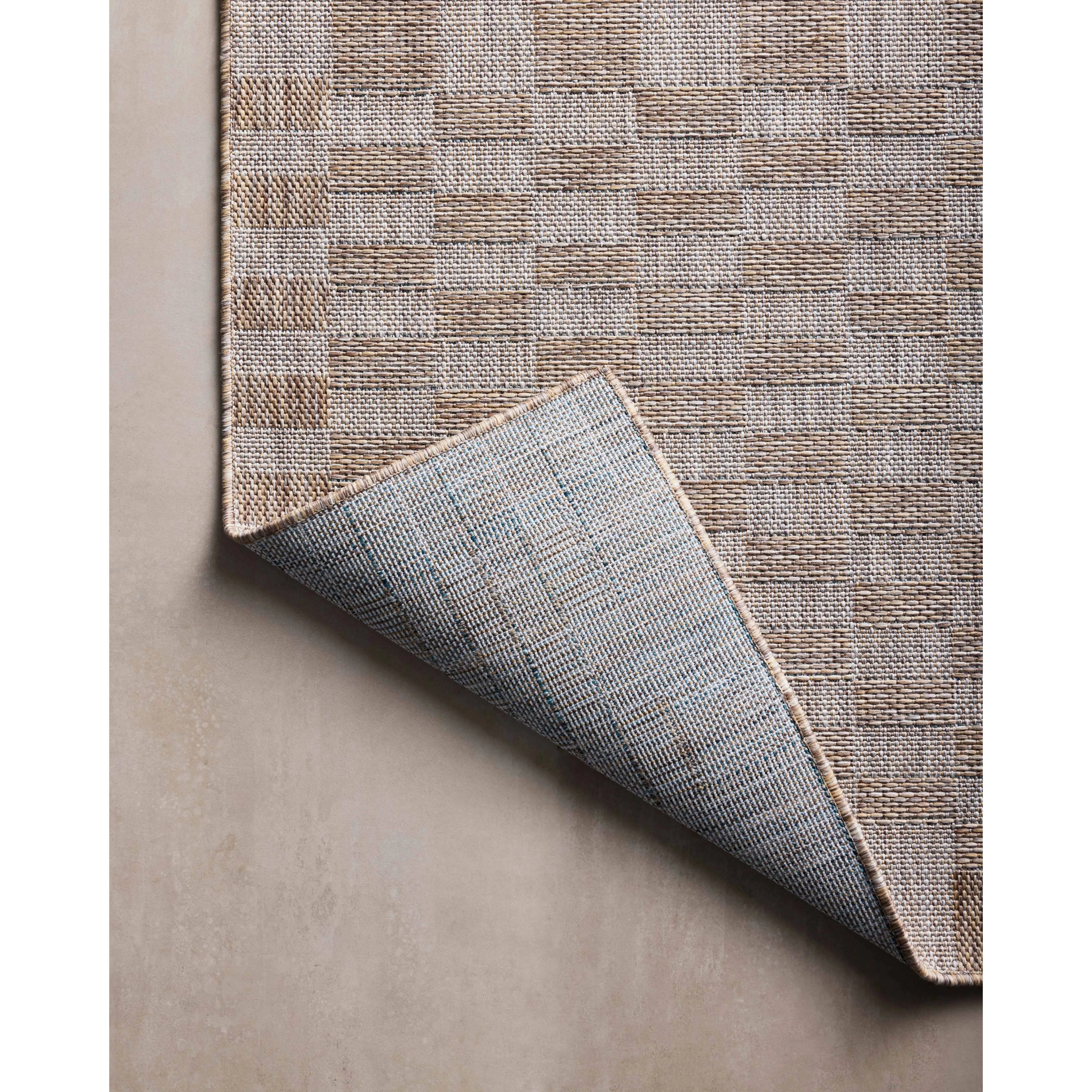 Inspired by the scenic mountain town in California, the Topanga Collection is an indoor/outdoor rug made of durable polypropylene that resembles natural fibers but is much more ready for sun, rain, and high-traffic use. Amethyst Home provides interior design, new home construction design consulting, vintage area rugs, and lighting in the Portland metro area.