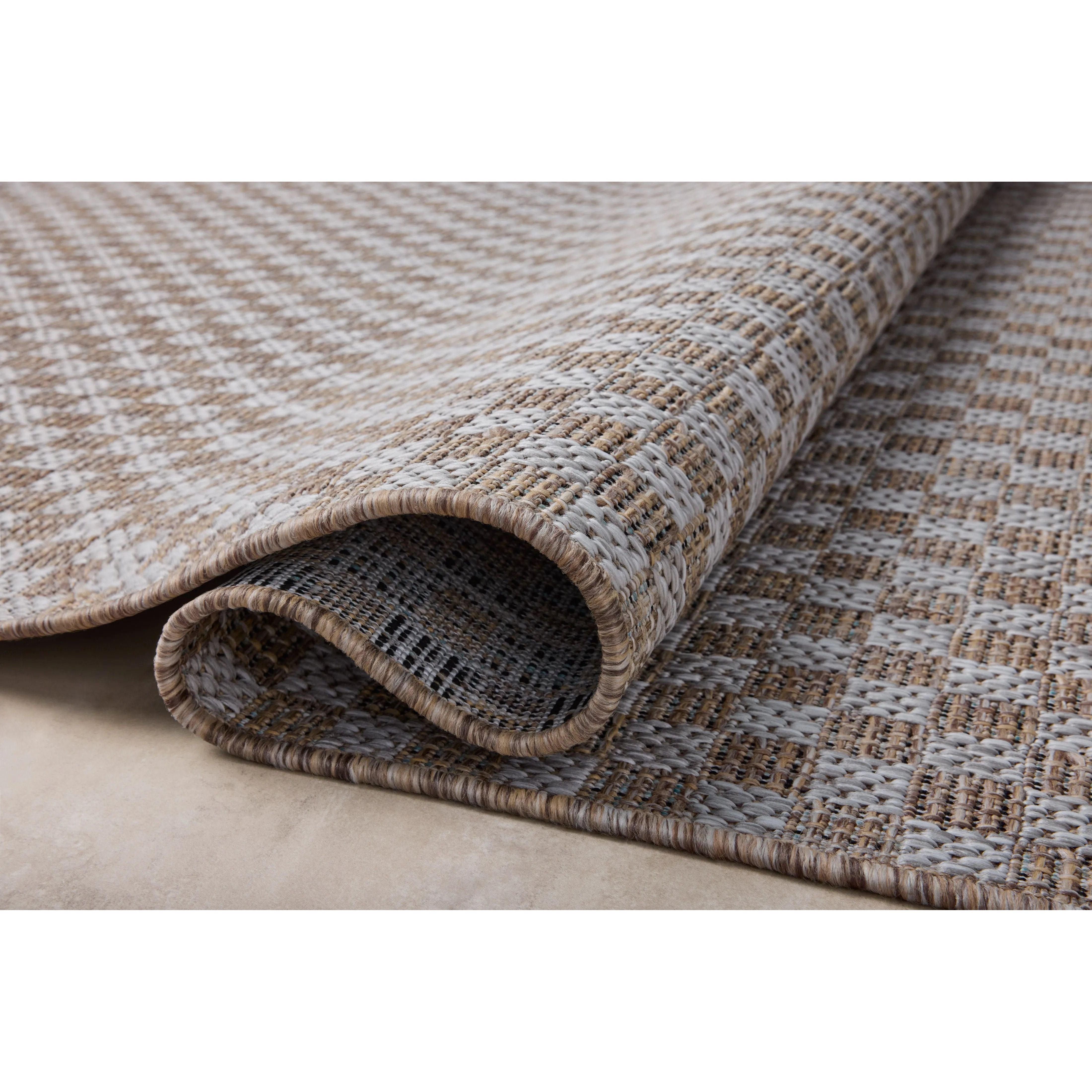 Inspired by the scenic mountain town in California, the Topanga Collection is an indoor/outdoor rug made of durable polypropylene that resembles natural fibers but is much more ready for sun, rain, and high-traffic use. Amethyst Home provides interior design, new home construction design consulting, vintage area rugs, and lighting in the Austin metro area.