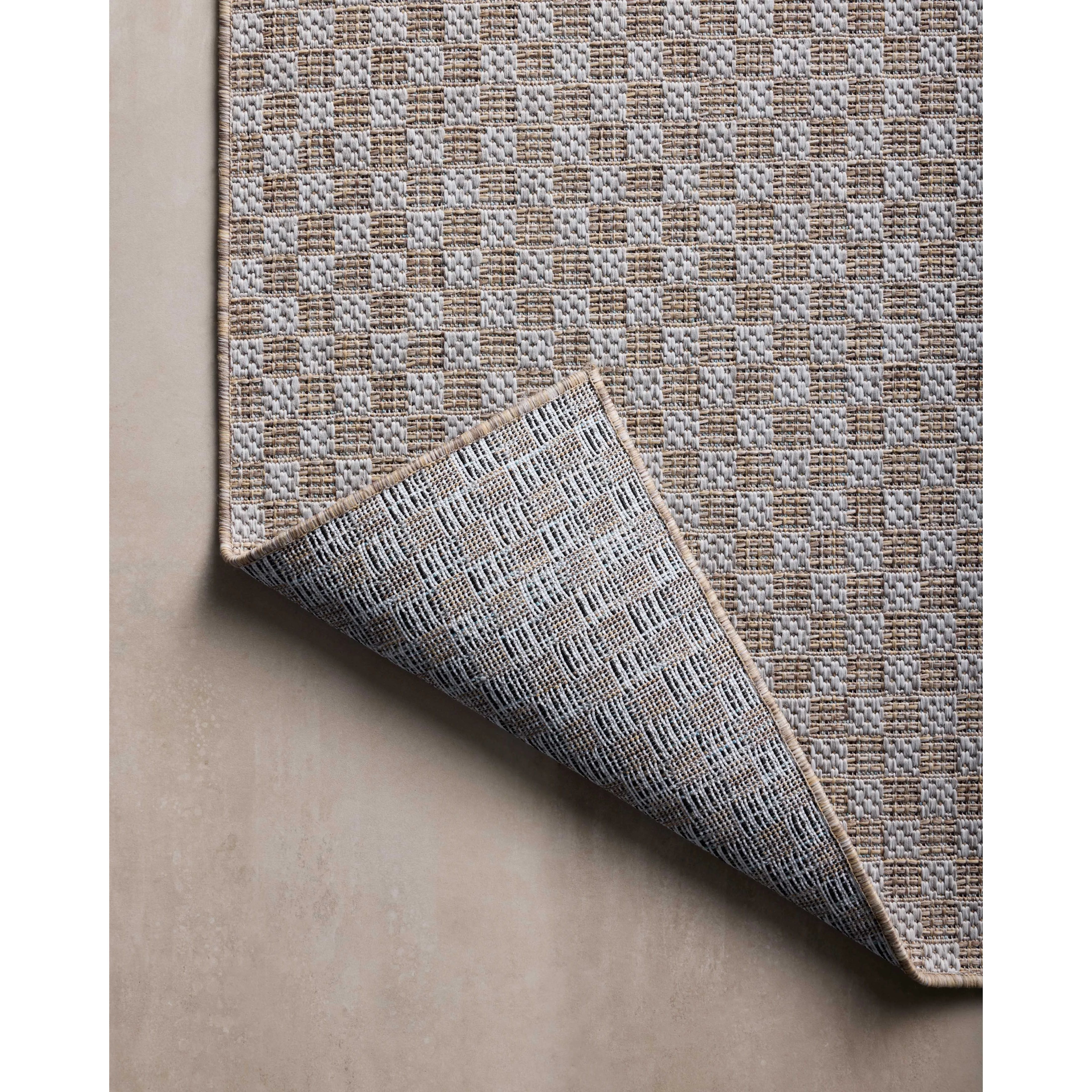 Inspired by the scenic mountain town in California, the Topanga Collection is an indoor/outdoor rug made of durable polypropylene that resembles natural fibers but is much more ready for sun, rain, and high-traffic use. Amethyst Home provides interior design, new home construction design consulting, vintage area rugs, and lighting in the Boston metro area.