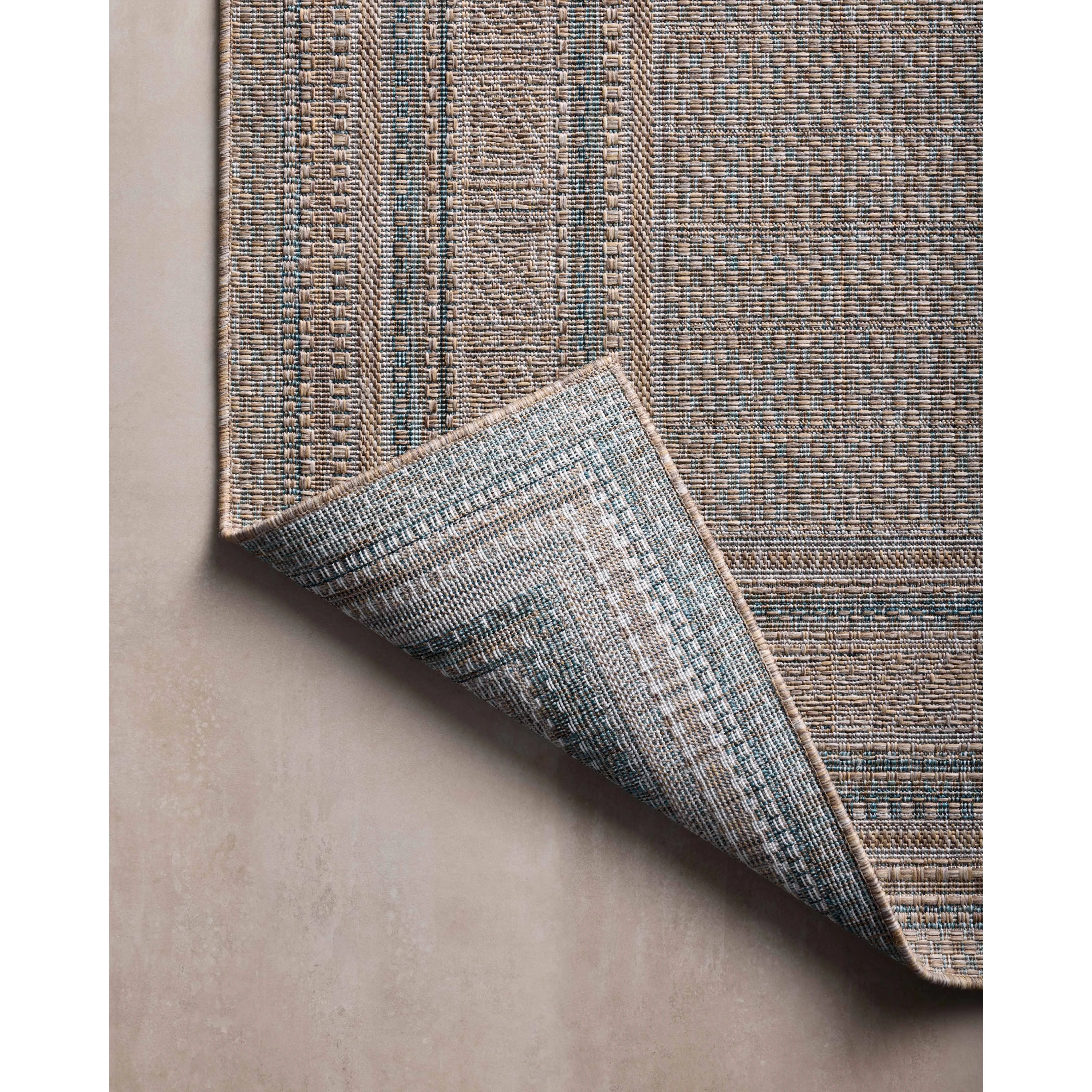 Inspired by the scenic mountain town in California, the Topanga Collection is an indoor/outdoor rug made of durable polypropylene that resembles natural fibers but is much more ready for sun, rain, and high-traffic use. Amethyst Home provides interior design, new home construction design consulting, vintage area rugs, and lighting in the Dallas metro area.