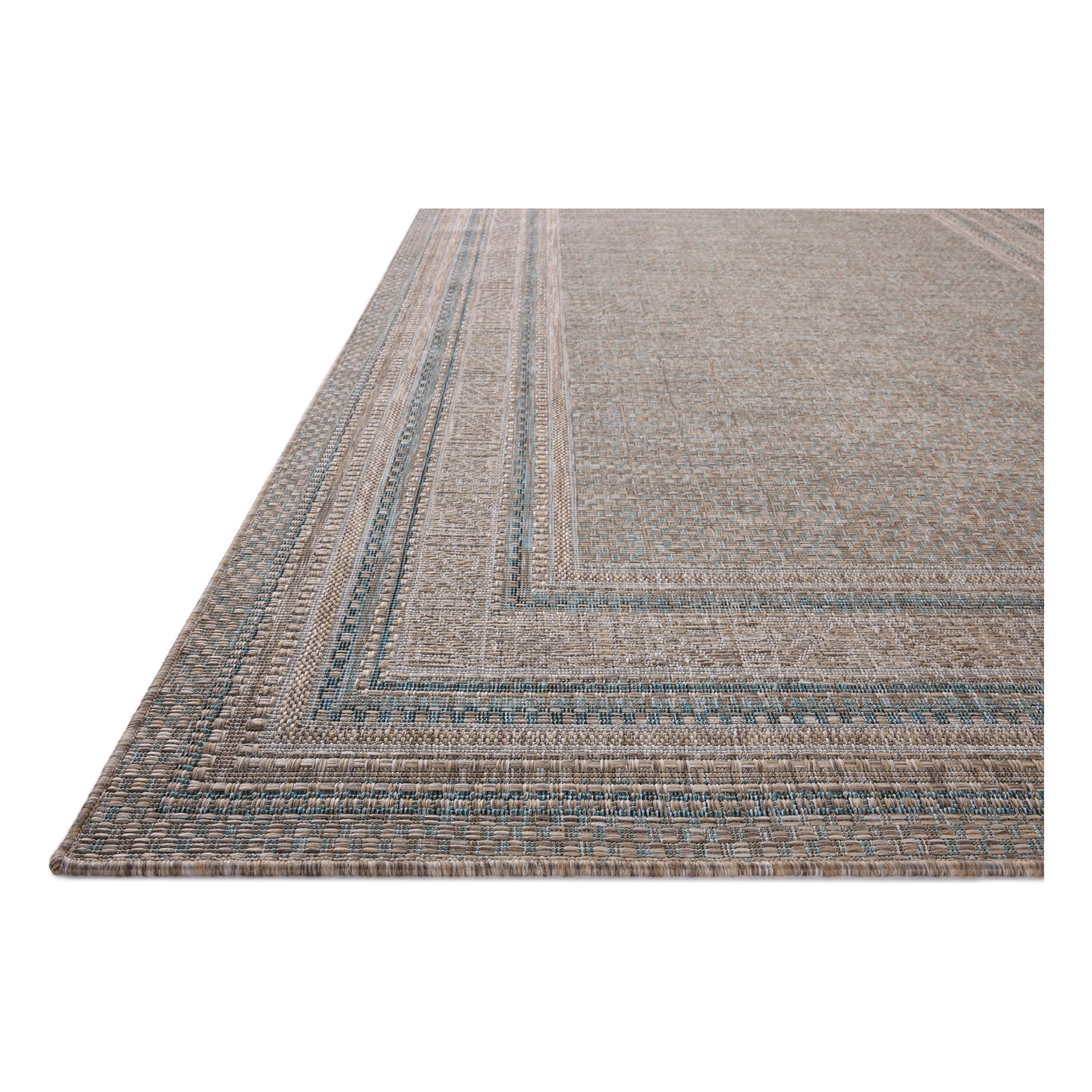 Inspired by the scenic mountain town in California, the Topanga Collection is an indoor/outdoor rug made of durable polypropylene that resembles natural fibers but is much more ready for sun, rain, and high-traffic use. Amethyst Home provides interior design, new home construction design consulting, vintage area rugs, and lighting in the Los Angeles metro area.
