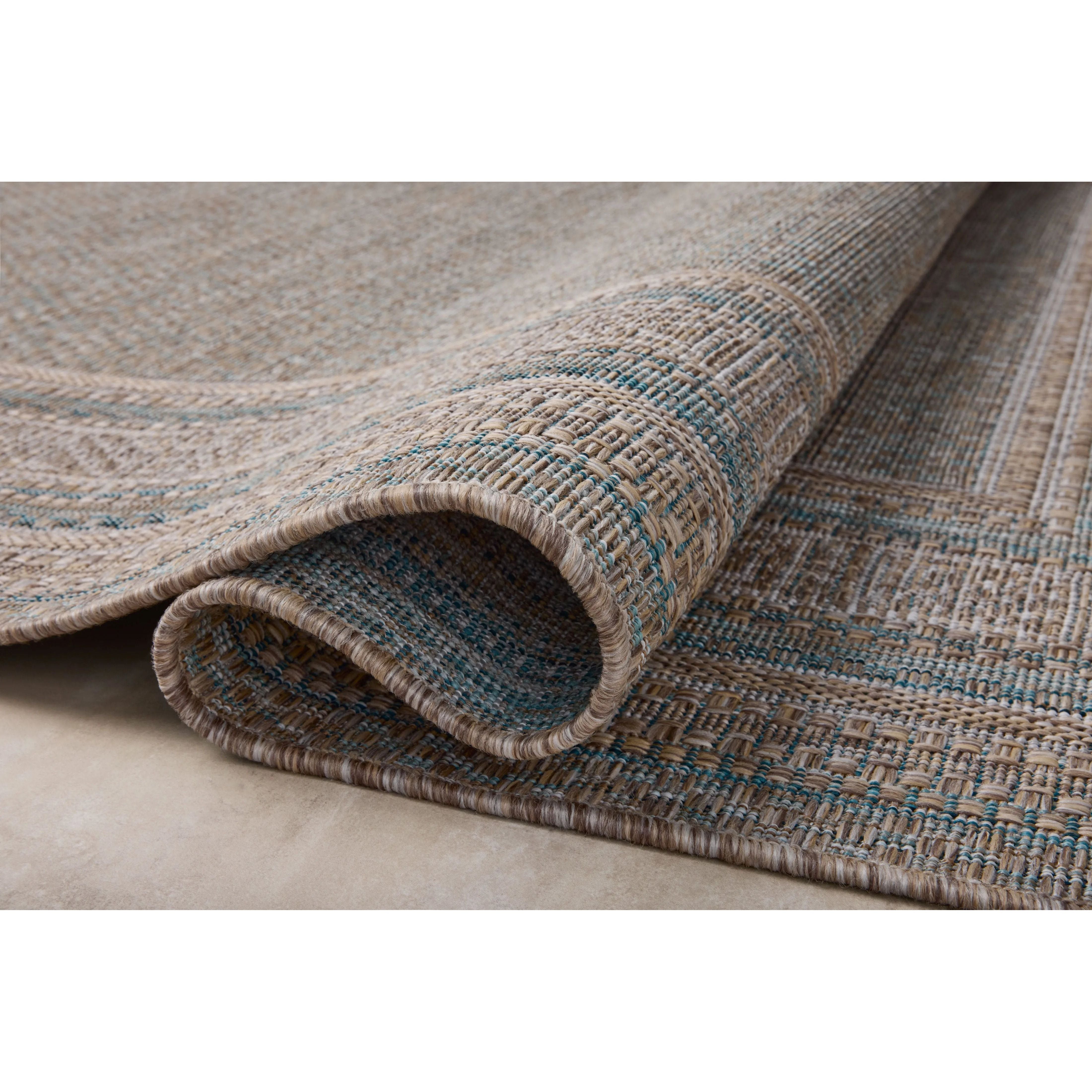 Inspired by the scenic mountain town in California, the Topanga Collection is an indoor/outdoor rug made of durable polypropylene that resembles natural fibers but is much more ready for sun, rain, and high-traffic use. Amethyst Home provides interior design, new home construction design consulting, vintage area rugs, and lighting in the Omaha metro area.