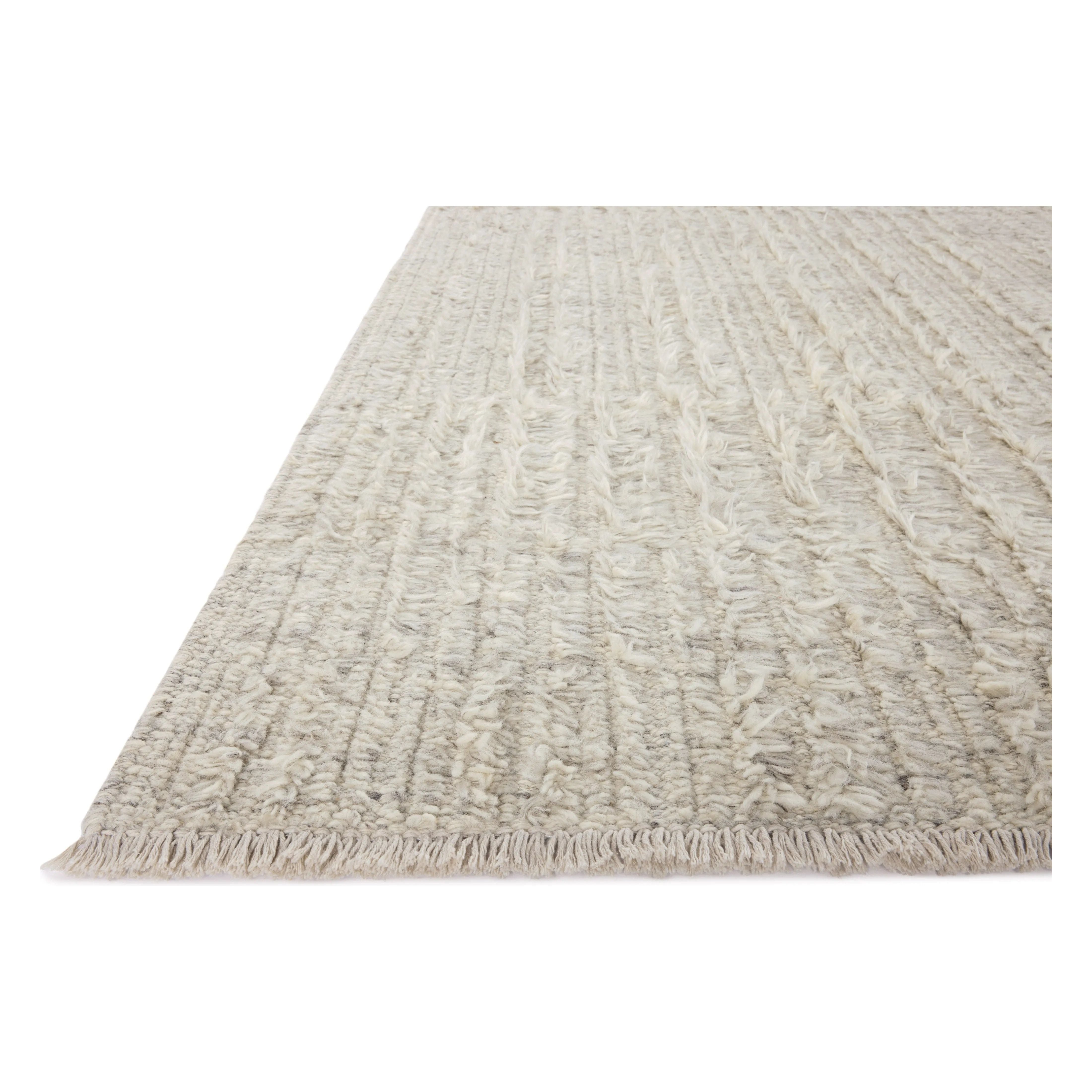 Irresistible to walk upon, the Dana Birch Rug by Brigette Romanek x Loloi has a high-low texture that alternates between a subtly shaggy pile and a soft base. Horizontal broken stripes give the area rug a fresh and energized structure, while a finish of fringe along the edges accentuates its sense of movement. Amethyst Home provides interior design, new home construction design consulting, vintage area rugs, and lighting in the San Diego metro area.