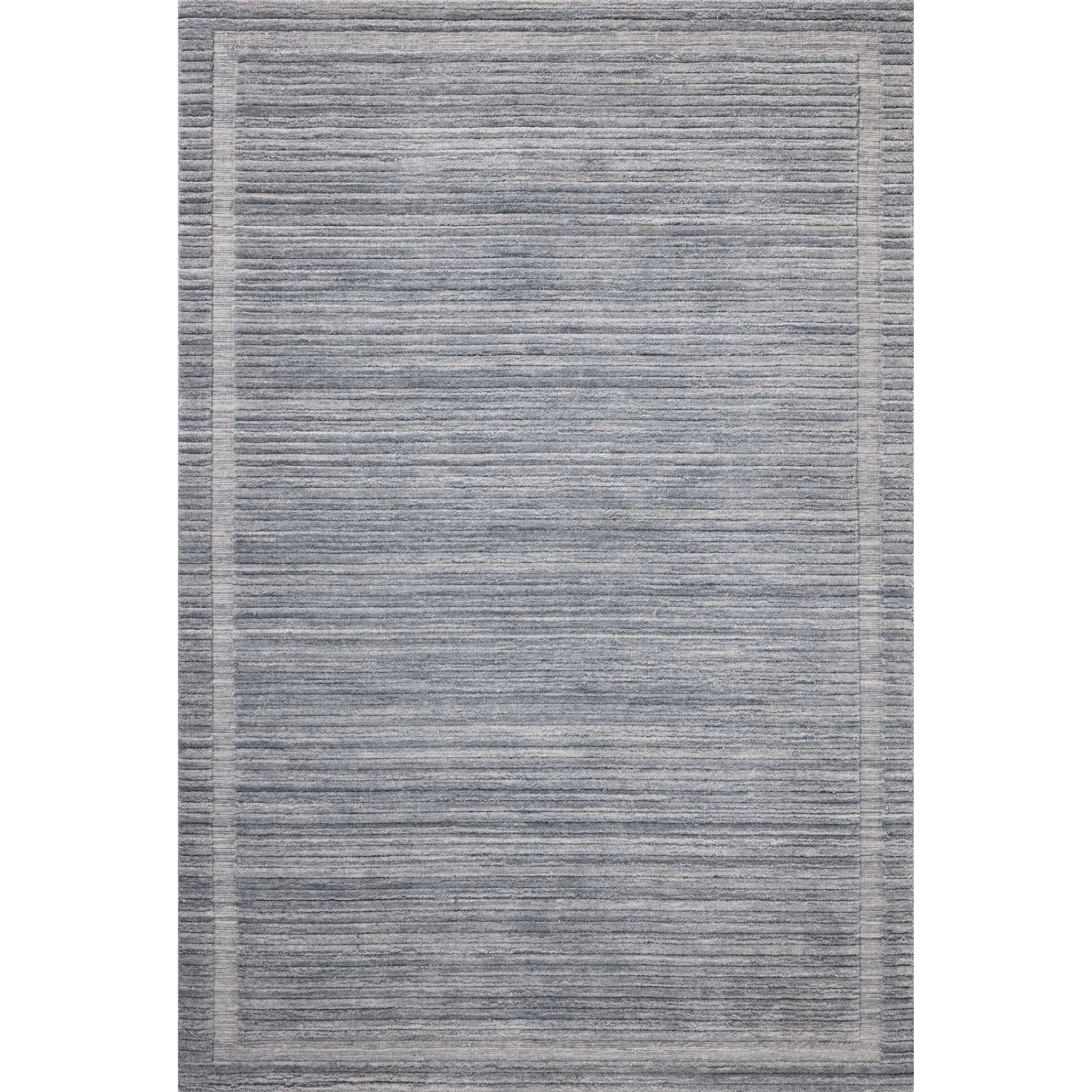 Irresistible to walk upon, the Dana Denim Rug by Brigette Romanek x Loloi has a high-low texture that alternates between a subtly shaggy pile and a soft base. Horizontal broken stripes give the area rug a fresh and energized structure, while a finish of fringe along the edges accentuates its sense of movement. Amethyst Home provides interior design, new home construction design consulting, vintage area rugs, and lighting in the Portland metro area.