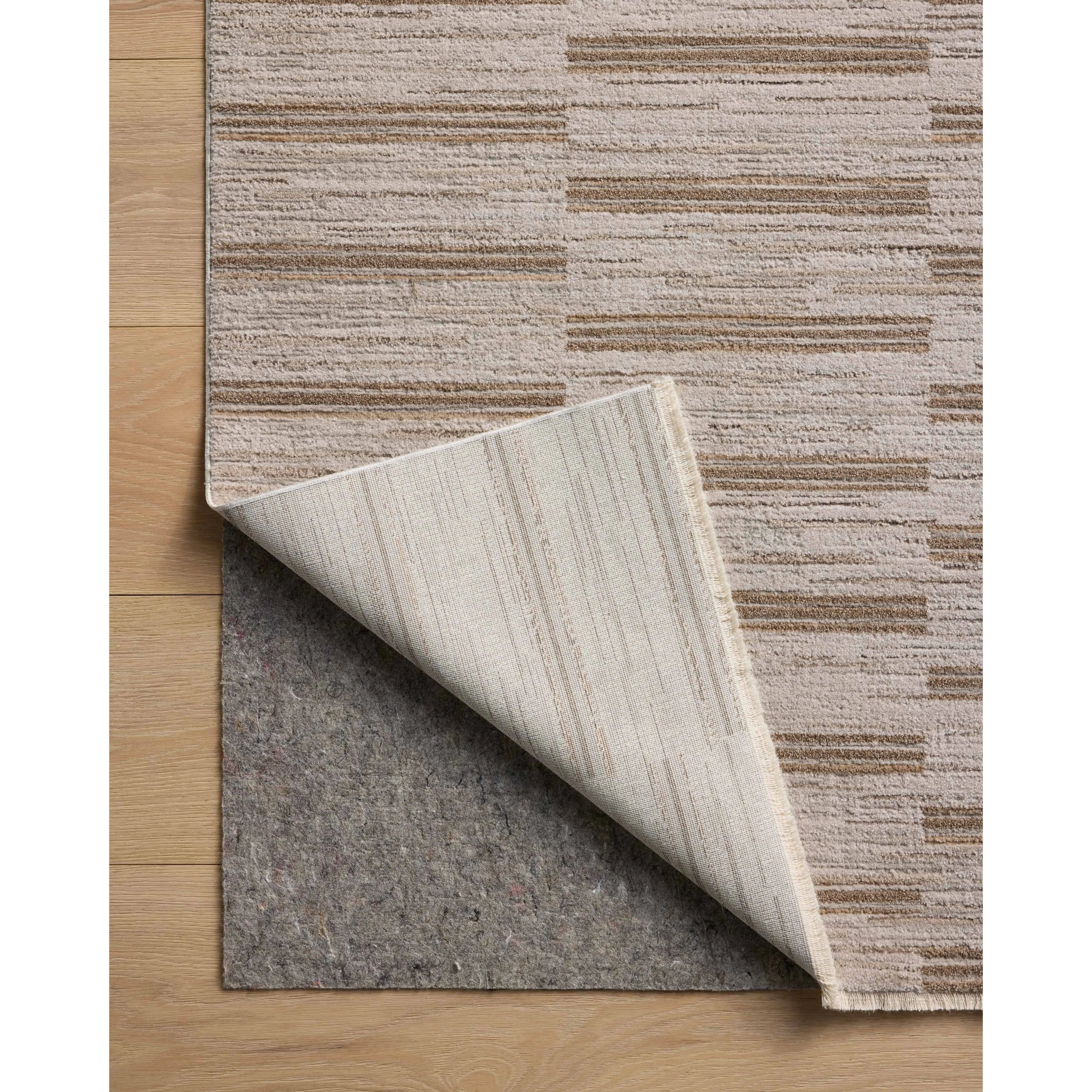 The Cali Collection by Amber Lewis x Loloi is a light-toned area rug with a casual geometric pattern that lends a neutral pattern to any space. Cali is power-loomed of polyester in Turkey for easy-to-clean, no-shed durability in high-traffic areas. This collection is also OEKO-TEX certified, ensuring its materials do not contain harmful substances. Amethyst Home provides interior design, new home construction design consulting, vintage area rugs, and lighting in the Charlotte metro area.