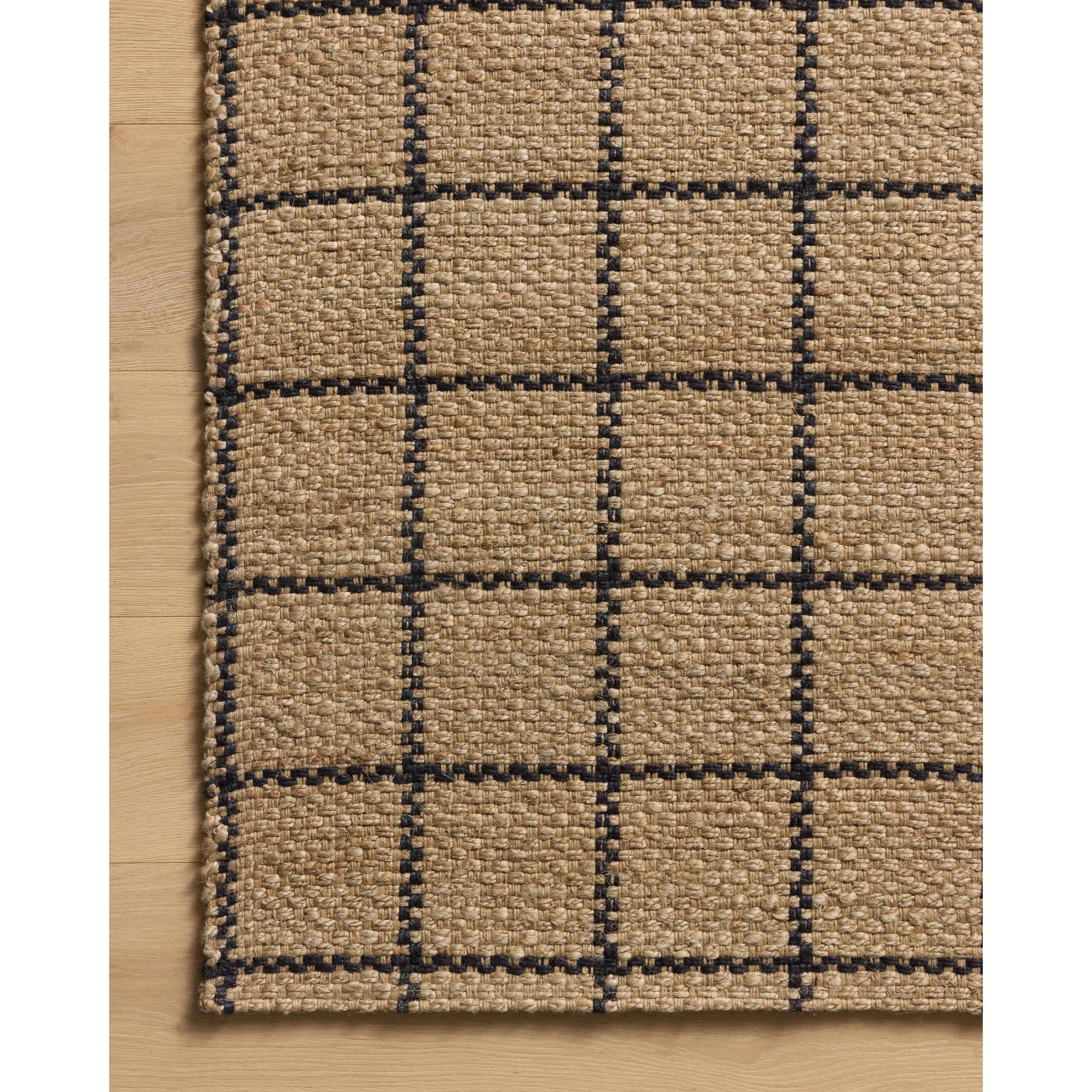 The Fletcher Collection from Chris Loves Julia x Loloi is a power-loomed jute rug with a large-scale grid pattern for an organic modern twist on a classic style. The rugs chunky texture and checkerboard-detailed lines are the refined details that Chris Loves Julia is known for, while the rugs natural palette allows for easy styling in any room. Amethyst Home provides interior design, new home construction design consulting, vintage area rugs, and lighting in the Charlotte metro area.