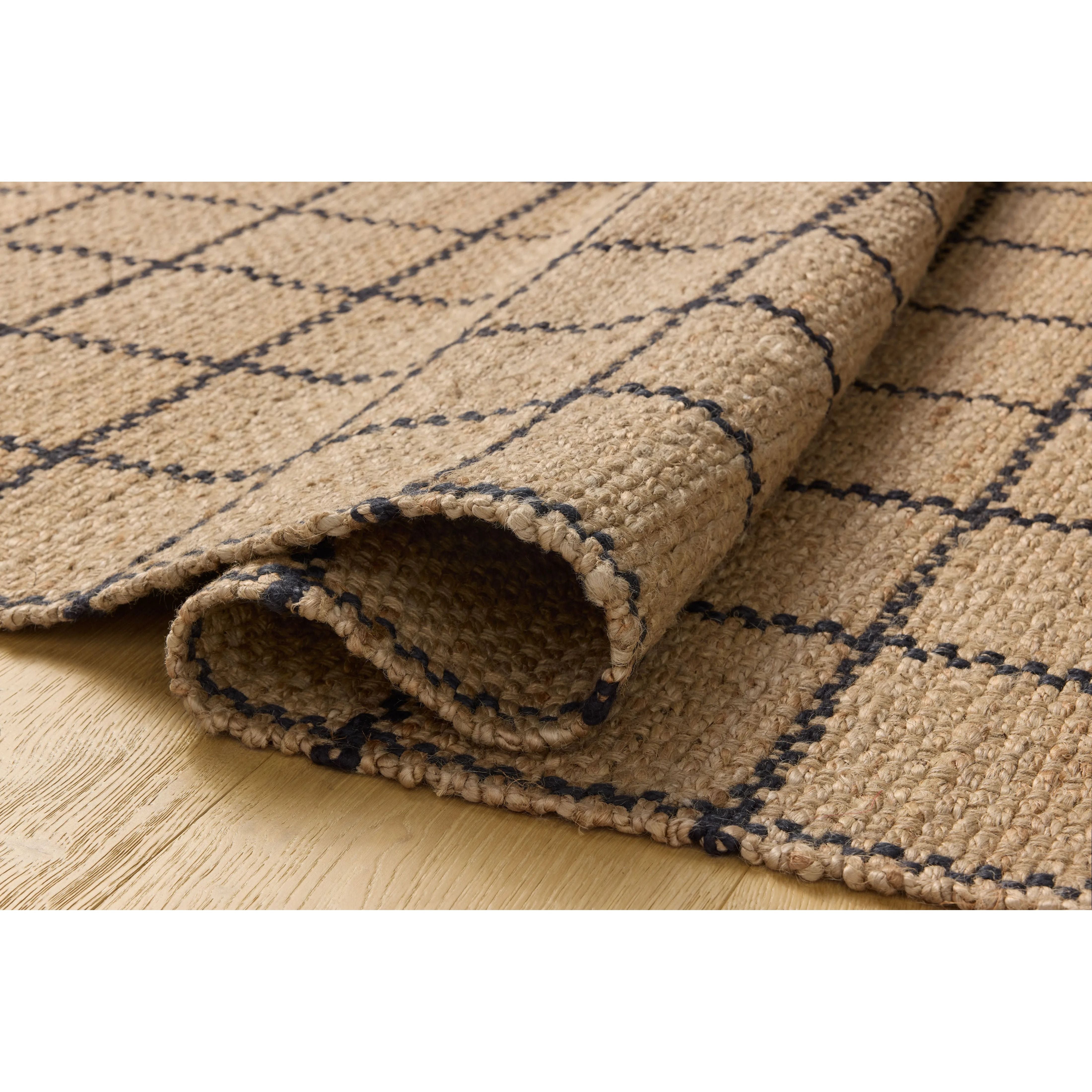The Fletcher Collection from Chris Loves Julia x Loloi is a power-loomed jute rug with a large-scale grid pattern for an organic modern twist on a classic style. The rugs chunky texture and checkerboard-detailed lines are the refined details that Chris Loves Julia is known for, while the rugs natural palette allows for easy styling in any room. Amethyst Home provides interior design, new home construction design consulting, vintage area rugs, and lighting in the Scottsdale metro area.