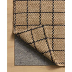 The Fletcher Collection from Chris Loves Julia x Loloi is a power-loomed jute rug with a large-scale grid pattern for an organic modern twist on a classic style. The rugs chunky texture and checkerboard-detailed lines are the refined details that Chris Loves Julia is known for, while the rugs natural palette allows for easy styling in any room. Amethyst Home provides interior design, new home construction design consulting, vintage area rugs, and lighting in the Winter Garden metro area.