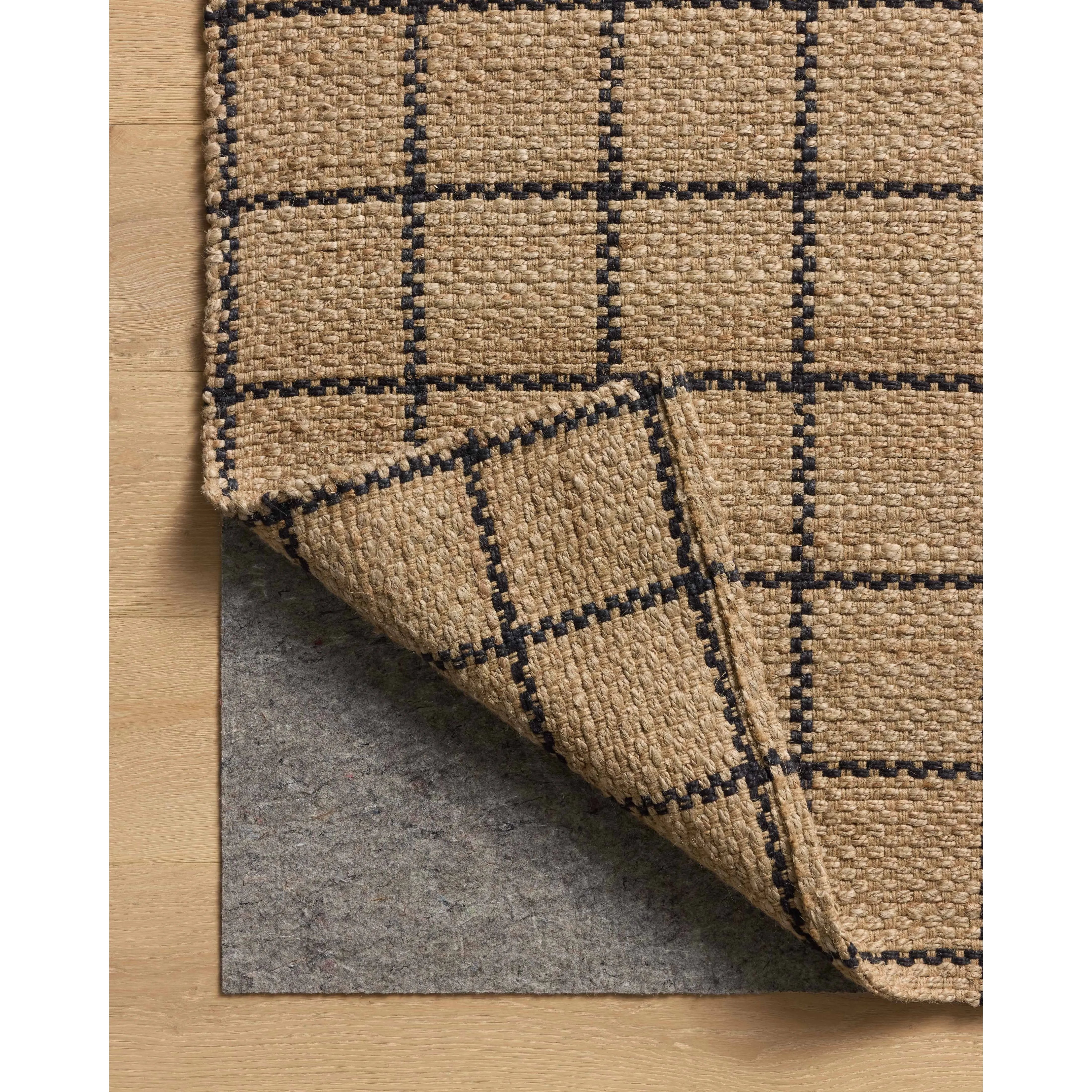 The Fletcher Collection from Chris Loves Julia x Loloi is a power-loomed jute rug with a large-scale grid pattern for an organic modern twist on a classic style. The rugs chunky texture and checkerboard-detailed lines are the refined details that Chris Loves Julia is known for, while the rugs natural palette allows for easy styling in any room. Amethyst Home provides interior design, new home construction design consulting, vintage area rugs, and lighting in the Winter Garden metro area.