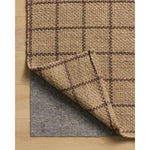 Featuring Chris Loves Julia × Loloi Fletcher Natural / Brown Rug by Loloi at Amethyst Home. The Fletcher Collection from Chris Loves Julia x Loloi is a power-loomed jute rug with a large-scale grid pattern for an organic modern twist on a classic style. The rugs chunky texture and checkerboard-detailed lines are the refined details that Chris Loves Julia . Amethyst Home provides interior design, new home construction design consulting, vintage area rugs, and lighting in the Los Angeles metro area.