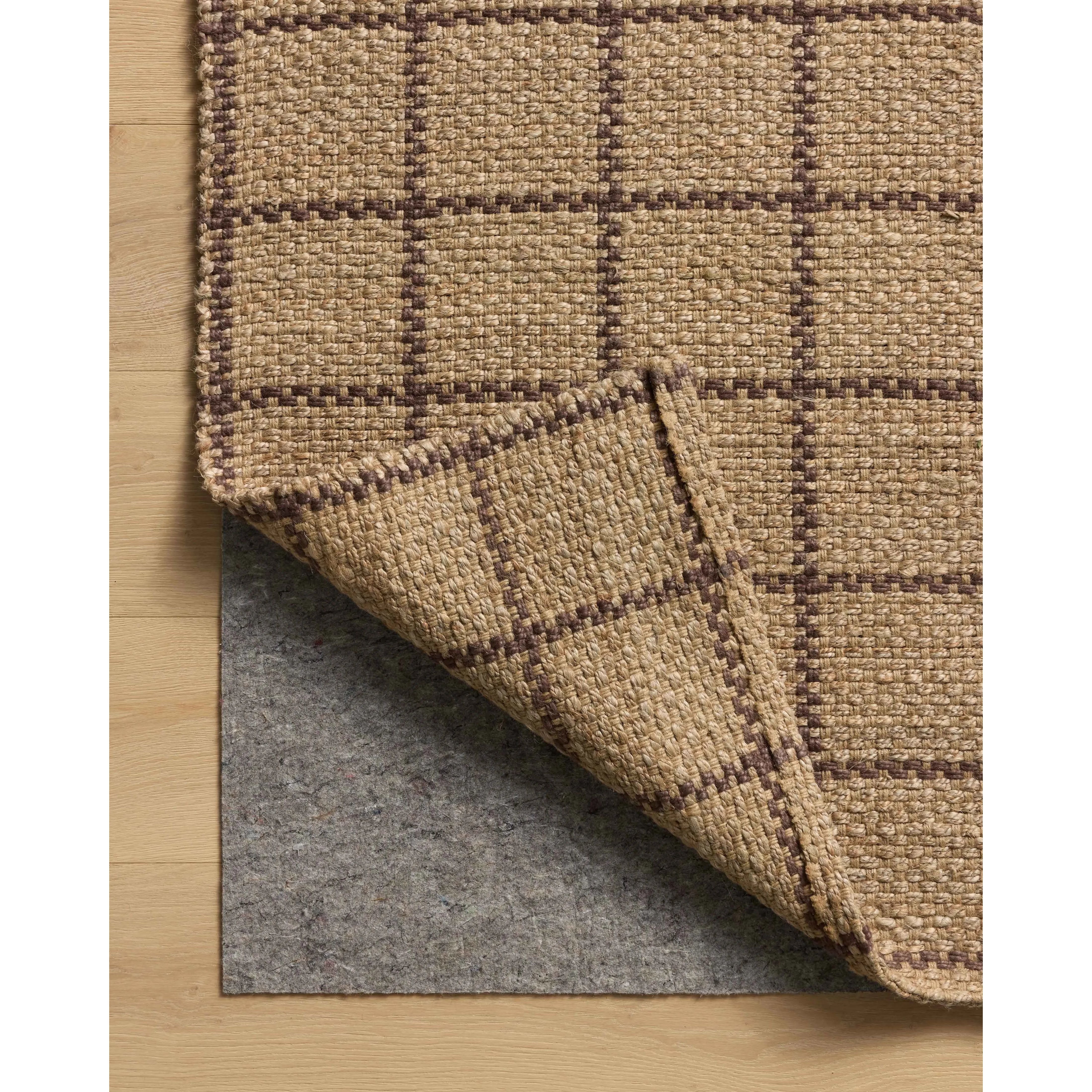 Featuring Chris Loves Julia × Loloi Fletcher Natural / Brown Rug by Loloi at Amethyst Home. The Fletcher Collection from Chris Loves Julia x Loloi is a power-loomed jute rug with a large-scale grid pattern for an organic modern twist on a classic style. The rugs chunky texture and checkerboard-detailed lines are the refined details that Chris Loves Julia . Amethyst Home provides interior design, new home construction design consulting, vintage area rugs, and lighting in the Los Angeles metro area.