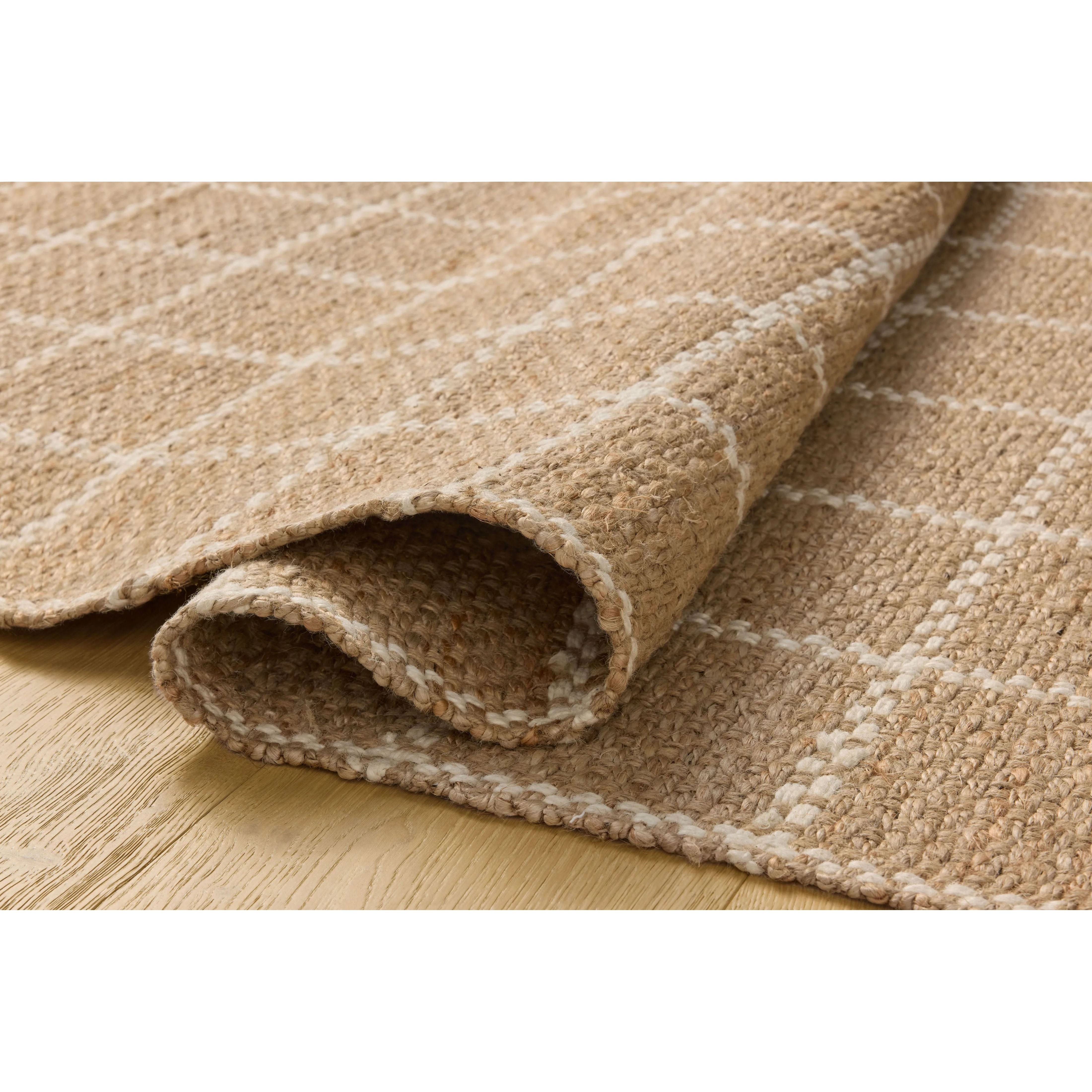 The Fletcher Collection from Chris Loves Julia x Loloi is a power-loomed jute rug with a large-scale grid pattern for an organic modern twist on a classic style. The rugs chunky texture and checkerboard-detailed lines are the refined details that Chris Loves Julia is known for, while the rugs natural palette allows for easy styling in any room. Amethyst Home provides interior design, new home construction design consulting, vintage area rugs, and lighting in the Park City metro area.