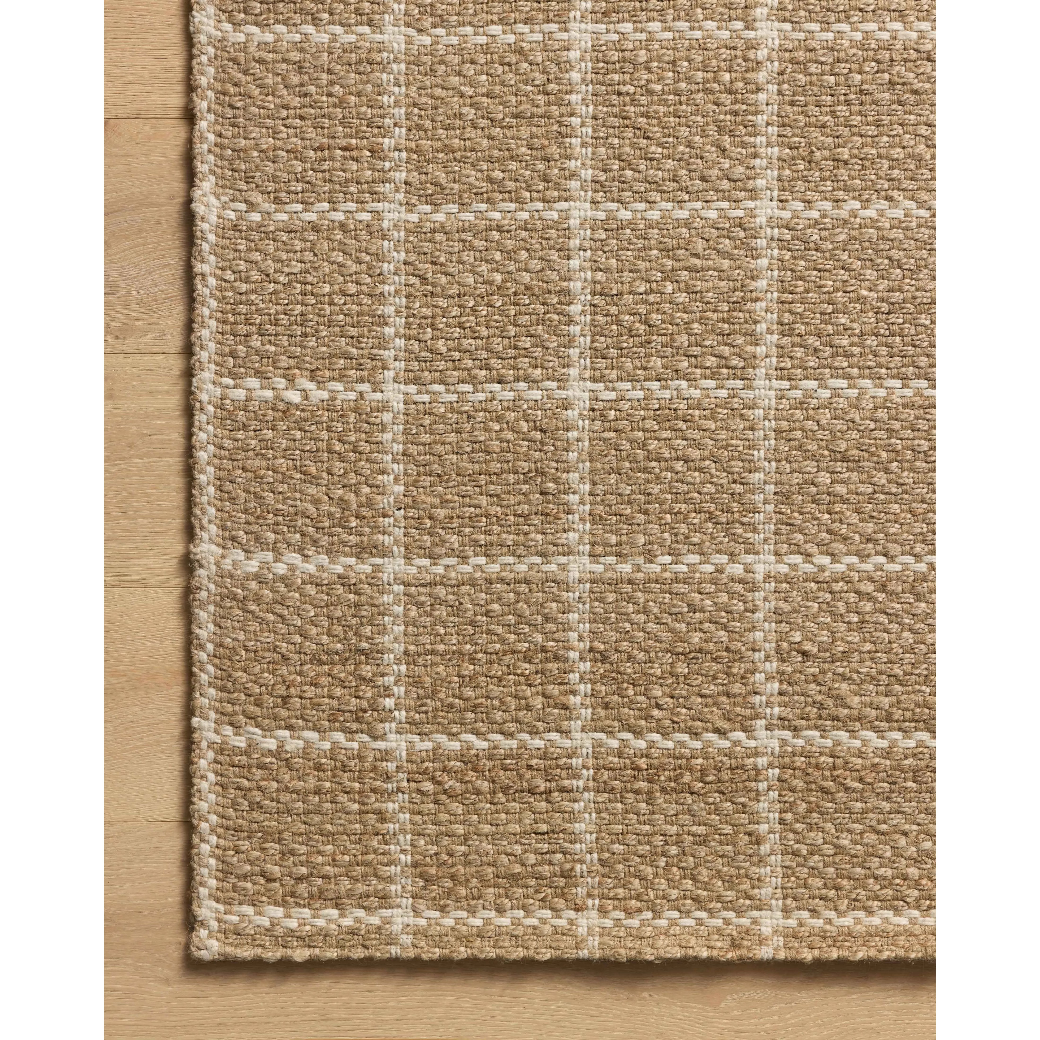 The Fletcher Collection from Chris Loves Julia x Loloi is a power-loomed jute rug with a large-scale grid pattern for an organic modern twist on a classic style. The rugs chunky texture and checkerboard-detailed lines are the refined details that Chris Loves Julia is known for, while the rugs natural palette allows for easy styling in any room. Amethyst Home provides interior design, new home construction design consulting, vintage area rugs, and lighting in the Winter Garden metro area.