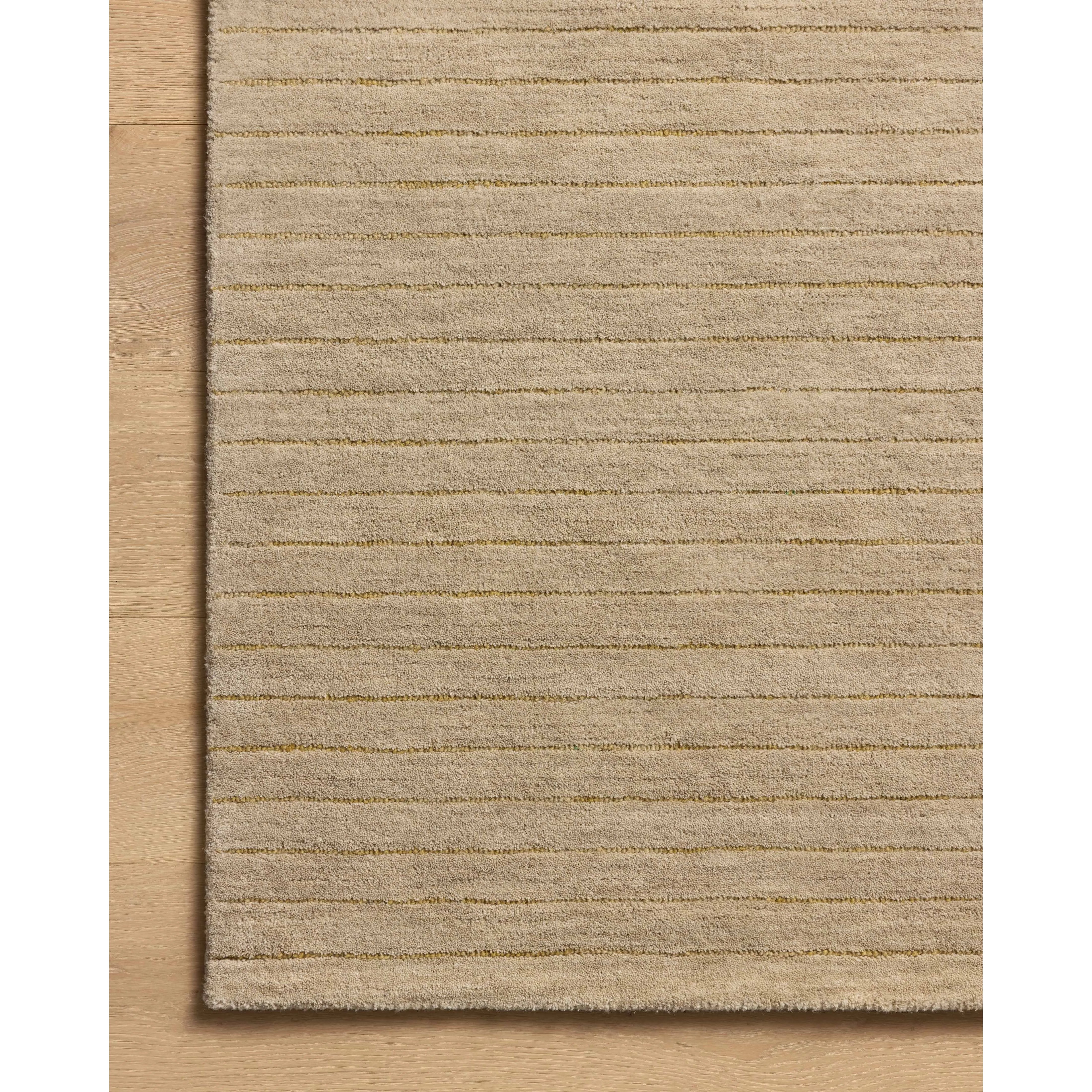 Featuring Chris Loves Julia × Loloi Henry Beige / Wheat Rug by Loloi at Amethyst Home. The Henry Collection from Chris Loves Julia x Loloi is a hand-tufted area rug that adds a touch of personality to a solid-colored design that can easily pair with other patterns in the room. These designs feature tufted stripes for subtle contrast and depth. The rugs wool. Amethyst Home provides interior design, new home construction design consulting, vintage area rugs, and lighting in the Nashville metro area.