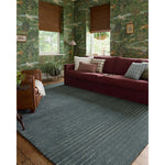 Featuring Chris Loves Julia × Loloi Henry Denim / Ivory Rug by Loloi at Amethyst Home. The Henry Collection from Chris Loves Julia x Loloi is a hand-tufted area rug that adds a touch of personality to a solid-colored design that can easily pair with other patterns in the room. These designs feature tufted stripes for subtle contrast and depth. The rugs wool. Amethyst Home provides interior design, new home construction design consulting, vintage area rugs, and lighting in the Charlotte metro area.