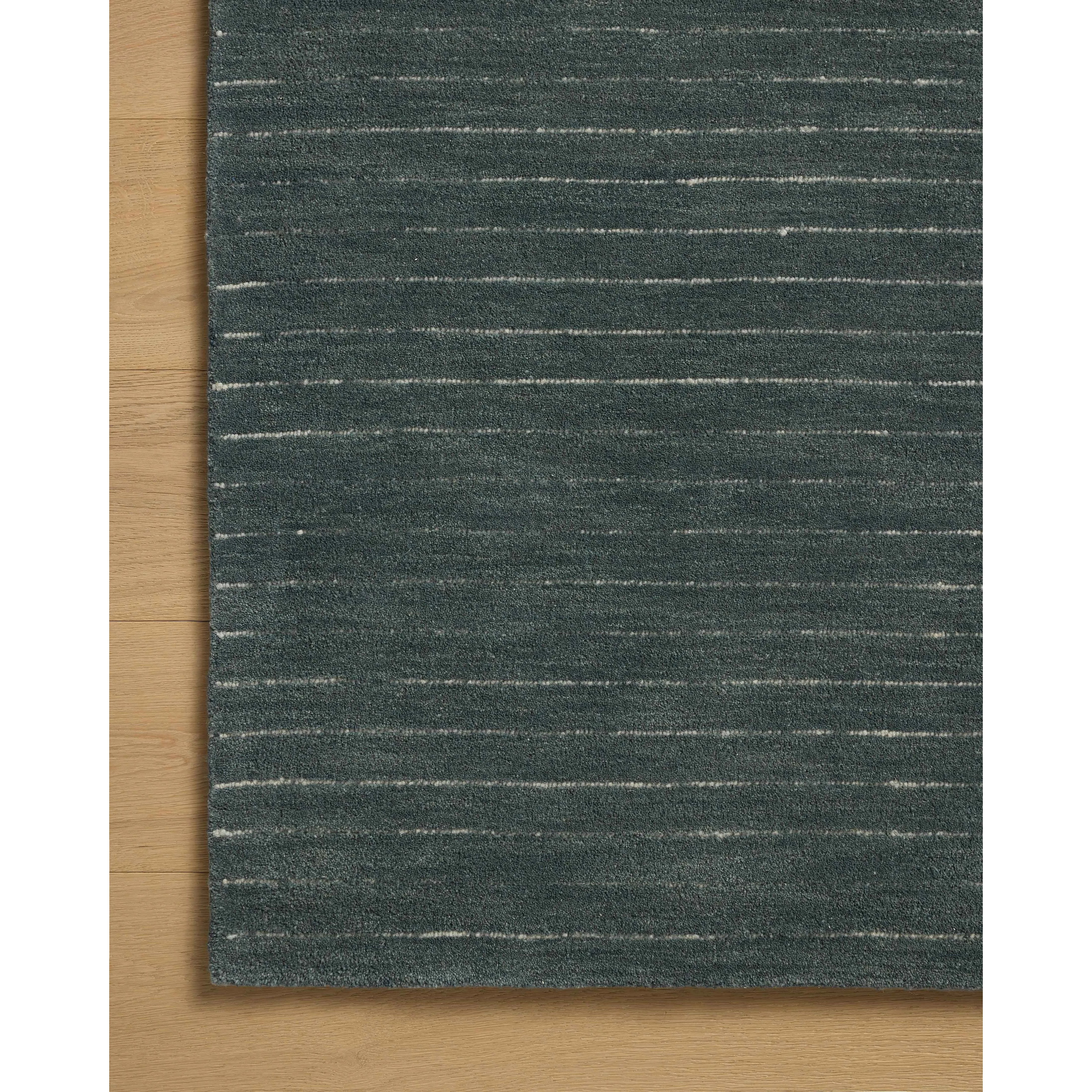 Featuring Chris Loves Julia × Loloi Henry Denim / Ivory Rug by Loloi at Amethyst Home. The Henry Collection from Chris Loves Julia x Loloi is a hand-tufted area rug that adds a touch of personality to a solid-colored design that can easily pair with other patterns in the room. These designs feature tufted stripes for subtle contrast and depth. The rugs wool. Amethyst Home provides interior design, new home construction design consulting, vintage area rugs, and lighting in the Nashville metro area.