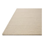 The Henry Collection from Chris Loves Julia x Loloi is a hand-tufted area rug that adds a touch of personality to a solid-colored design that can easily pair with other patterns in the room. These designs feature tufted stripes for subtle contrast and depth. The rugs wool pile is thick and satisfying to walk on, with gently nuanced color variation. Amethyst Home provides interior design, new home construction design consulting, vintage area rugs, and lighting in the Kansas City metro area.