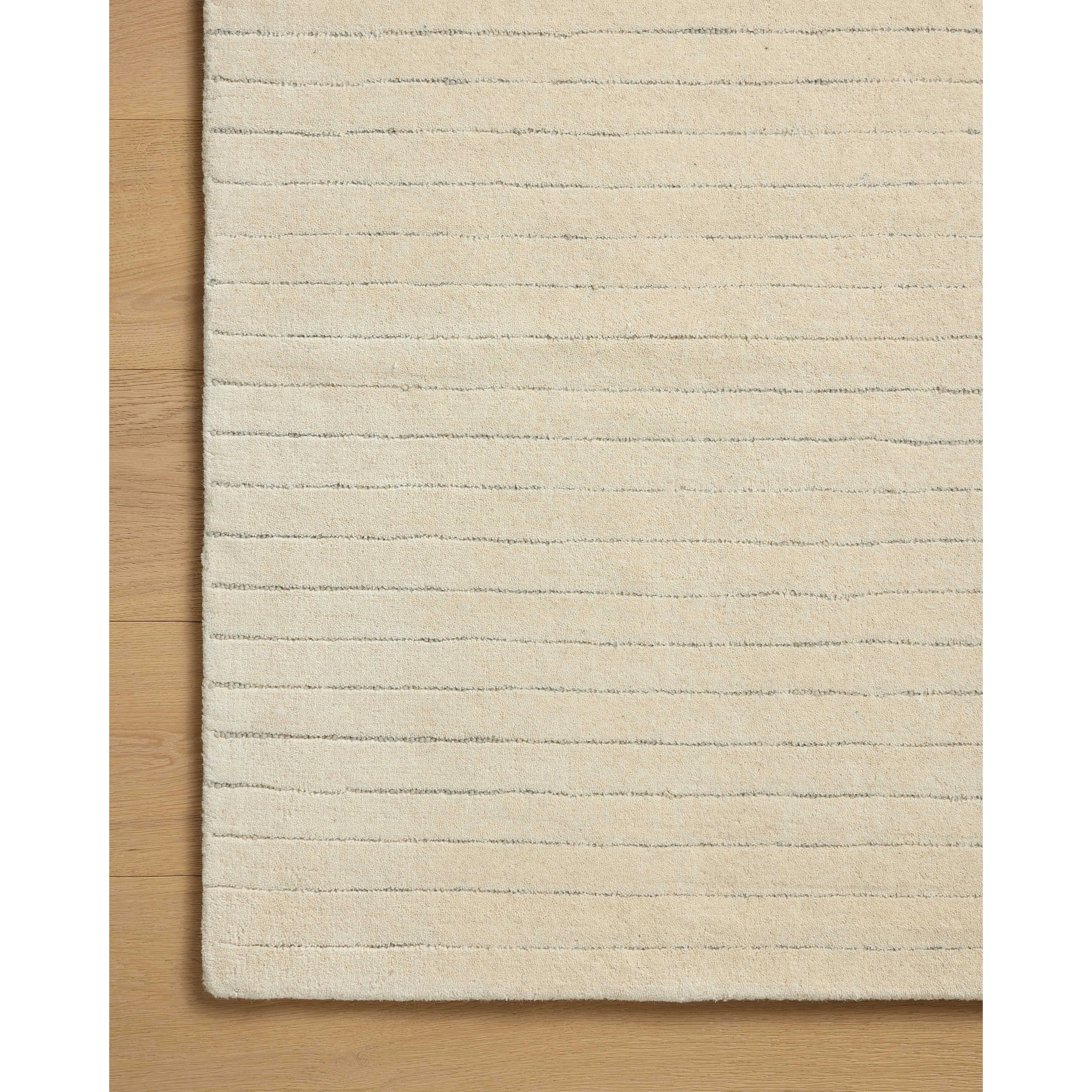 The Henry Collection from Chris Loves Julia x Loloi is a hand-tufted area rug that adds a touch of personality to a solid-colored design that can easily pair with other patterns in the room. These designs feature tufted stripes for subtle contrast and depth. The rugs wool pile is thick and satisfying to walk on, with gently nuanced color variation. Amethyst Home provides interior design, new home construction design consulting, vintage area rugs, and lighting in the Nashville metro area.