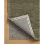 The Henry Collection from Chris Loves Julia x Loloi is a hand-tufted area rug that adds a touch of personality to a solid-colored design that can easily pair with other patterns in the room. These designs feature tufted stripes for subtle contrast and depth. The rugs wool pile is thick and satisfying to walk on, with gently nuanced color variation. Amethyst Home provides interior design, new home construction design consulting, vintage area rugs, and lighting in the Boston metro area.