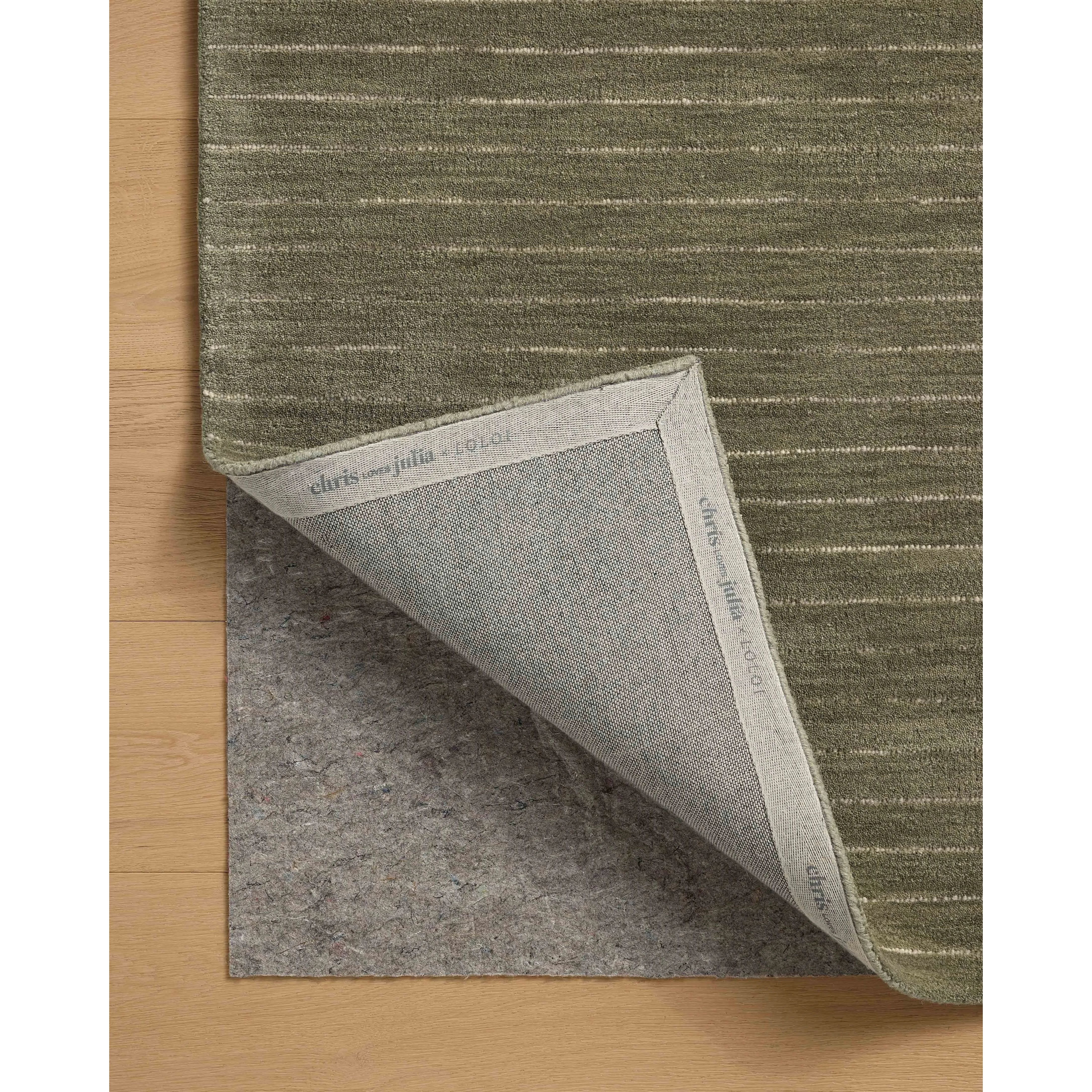 The Henry Collection from Chris Loves Julia x Loloi is a hand-tufted area rug that adds a touch of personality to a solid-colored design that can easily pair with other patterns in the room. These designs feature tufted stripes for subtle contrast and depth. The rugs wool pile is thick and satisfying to walk on, with gently nuanced color variation. Amethyst Home provides interior design, new home construction design consulting, vintage area rugs, and lighting in the Boston metro area.