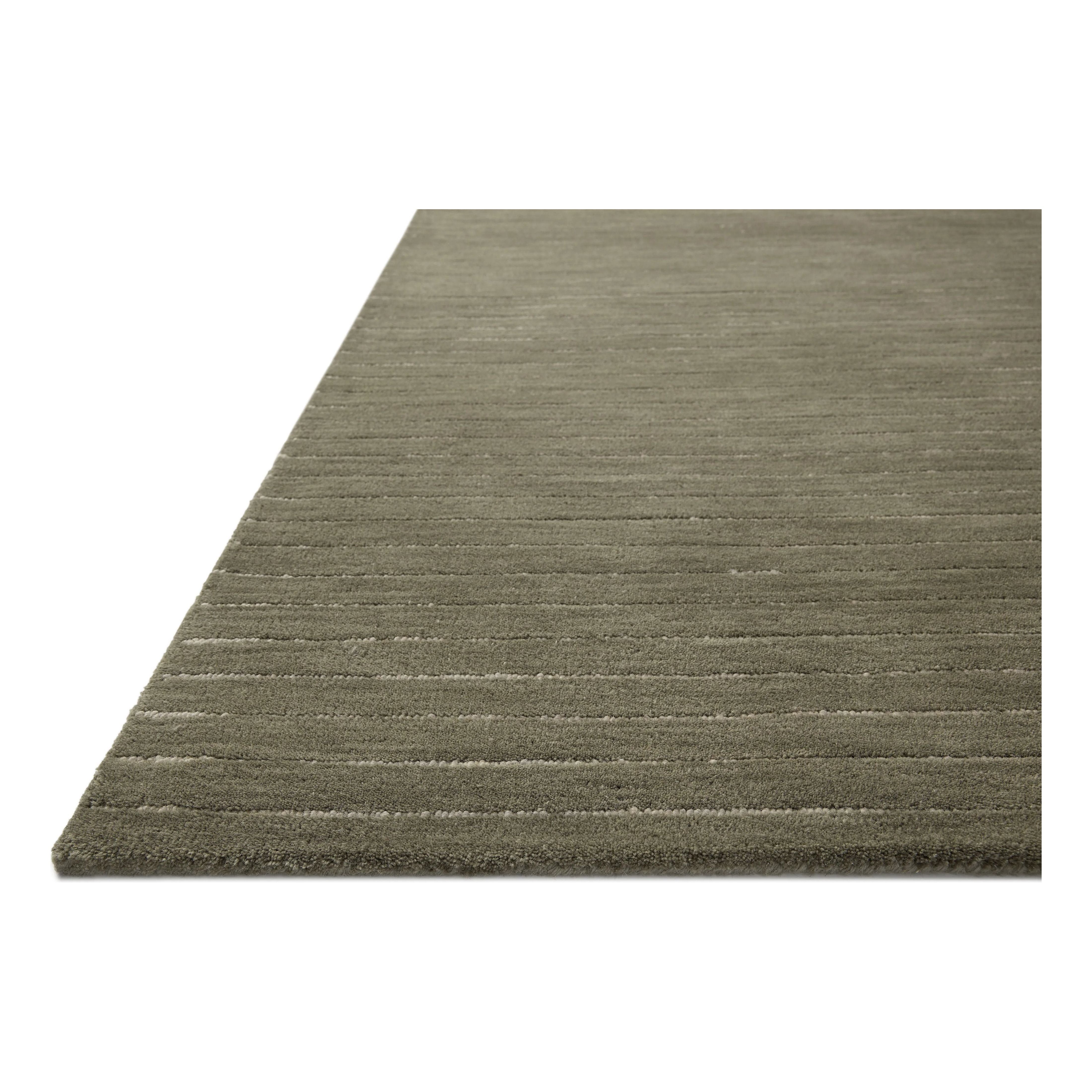 The Henry Collection from Chris Loves Julia x Loloi is a hand-tufted area rug that adds a touch of personality to a solid-colored design that can easily pair with other patterns in the room. These designs feature tufted stripes for subtle contrast and depth. The rugs wool pile is thick and satisfying to walk on, with gently nuanced color variation. Amethyst Home provides interior design, new home construction design consulting, vintage area rugs, and lighting in the Scottsdale metro area.
