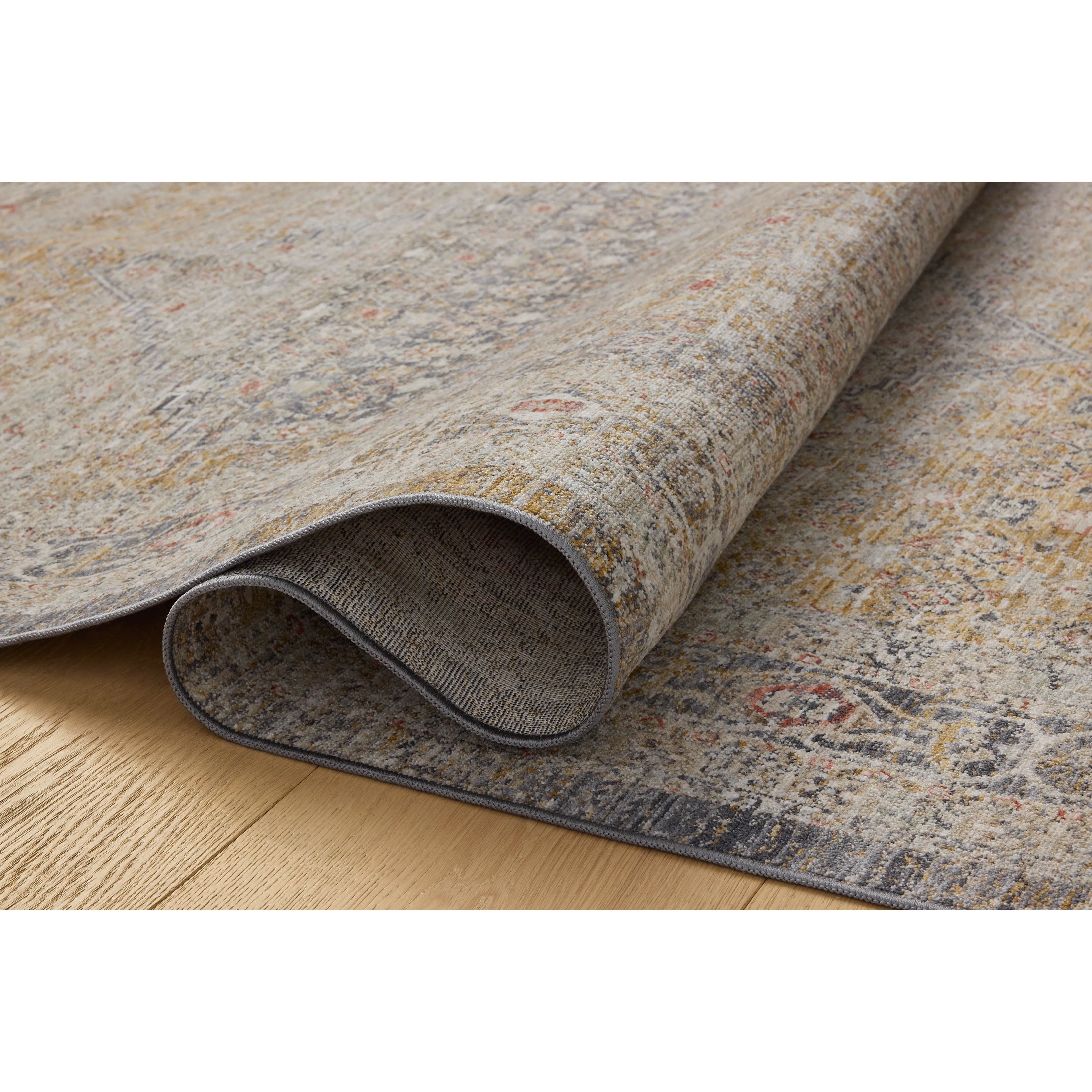 The Ida Collection from Chris Loves Julia x Loloi is a vintage-inspired area rug with a soft, subtly textured pile similar to hand-knotted rugs. The rugs gentle distressing creates a timeless look, while its durability and earthy colorways make it a great choice for the busiest rooms of the home, especially living rooms, kitchens, and hallways. Amethyst Home provides interior design, new home construction design consulting, vintage area rugs, and lighting in the Alpharetta metro area.