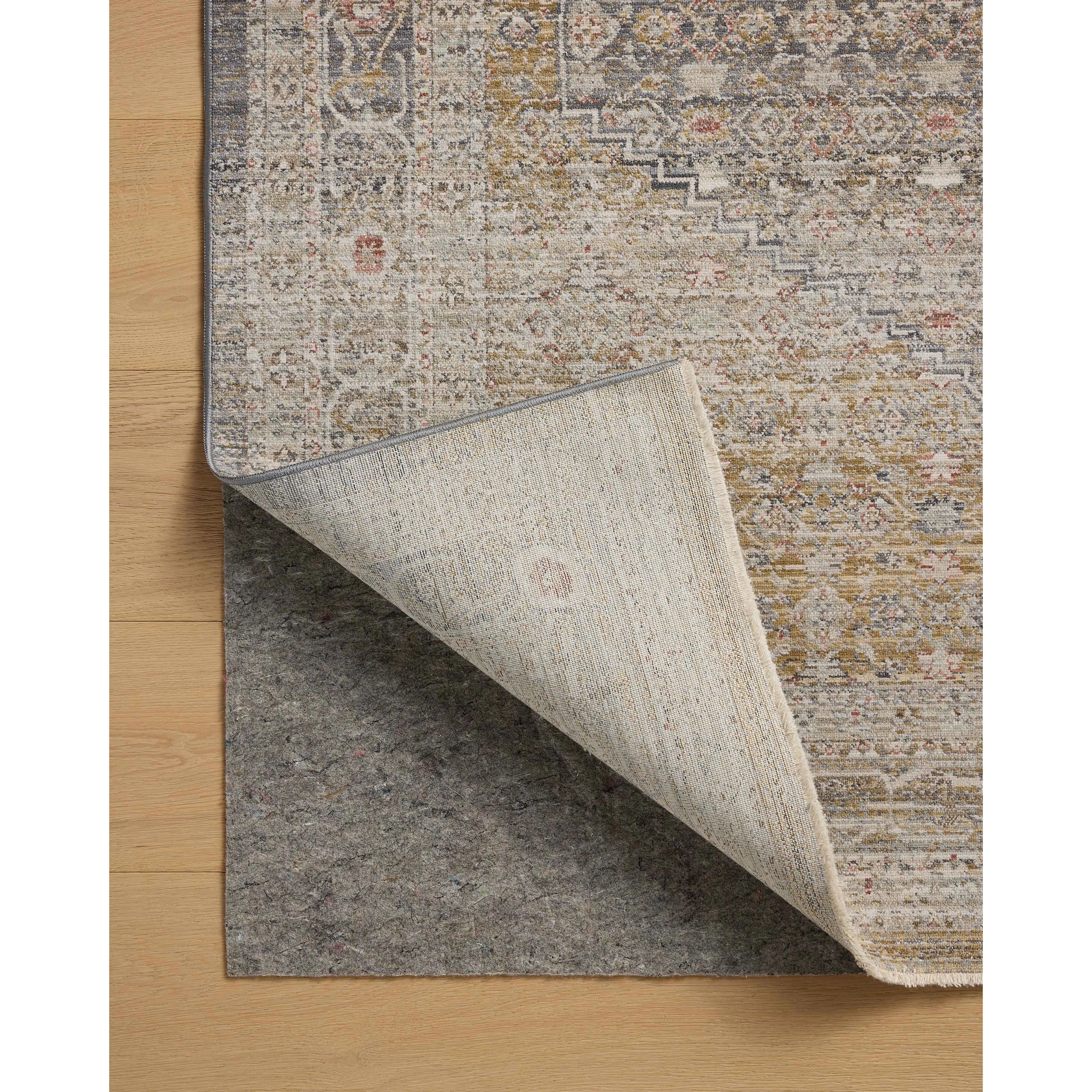 The Ida Collection from Chris Loves Julia x Loloi is a vintage-inspired area rug with a soft, subtly textured pile similar to hand-knotted rugs. The rugs gentle distressing creates a timeless look, while its durability and earthy colorways make it a great choice for the busiest rooms of the home, especially living rooms, kitchens, and hallways. Amethyst Home provides interior design, new home construction design consulting, vintage area rugs, and lighting in the Los Angeles metro area.