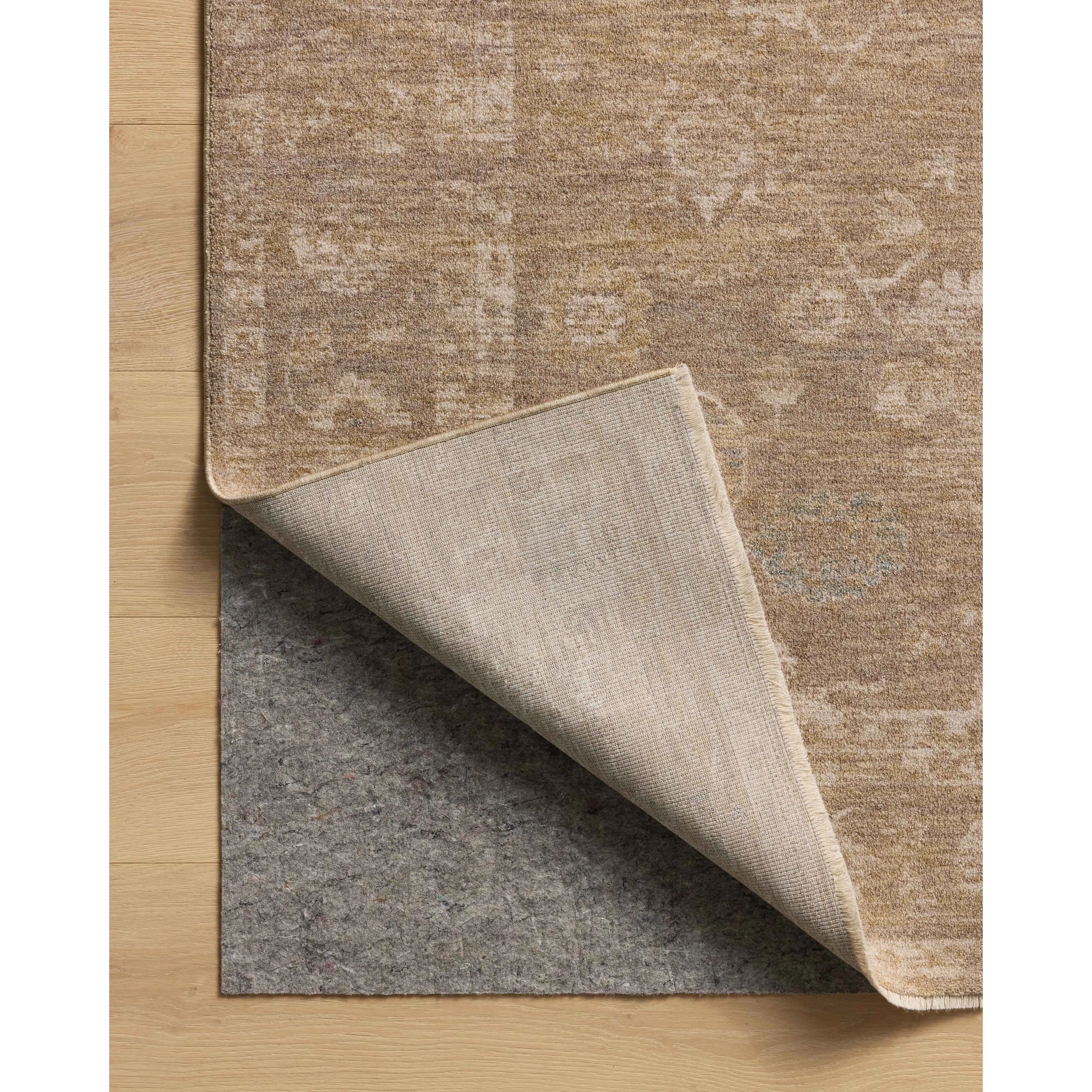 The Louisa Collection is a serene area rug based on beautiful, traditional Turkish designs updated in calm colorways by Chris Loves Julia in collaboration with Loloi. Pale blues, creams, and browns create a sense of softness, but so does the rugs pile, which is made of easy-to-clean, velvety polyester. Amethyst Home provides interior design, new home construction design consulting, vintage area rugs, and lighting in the Winter Garden metro area.