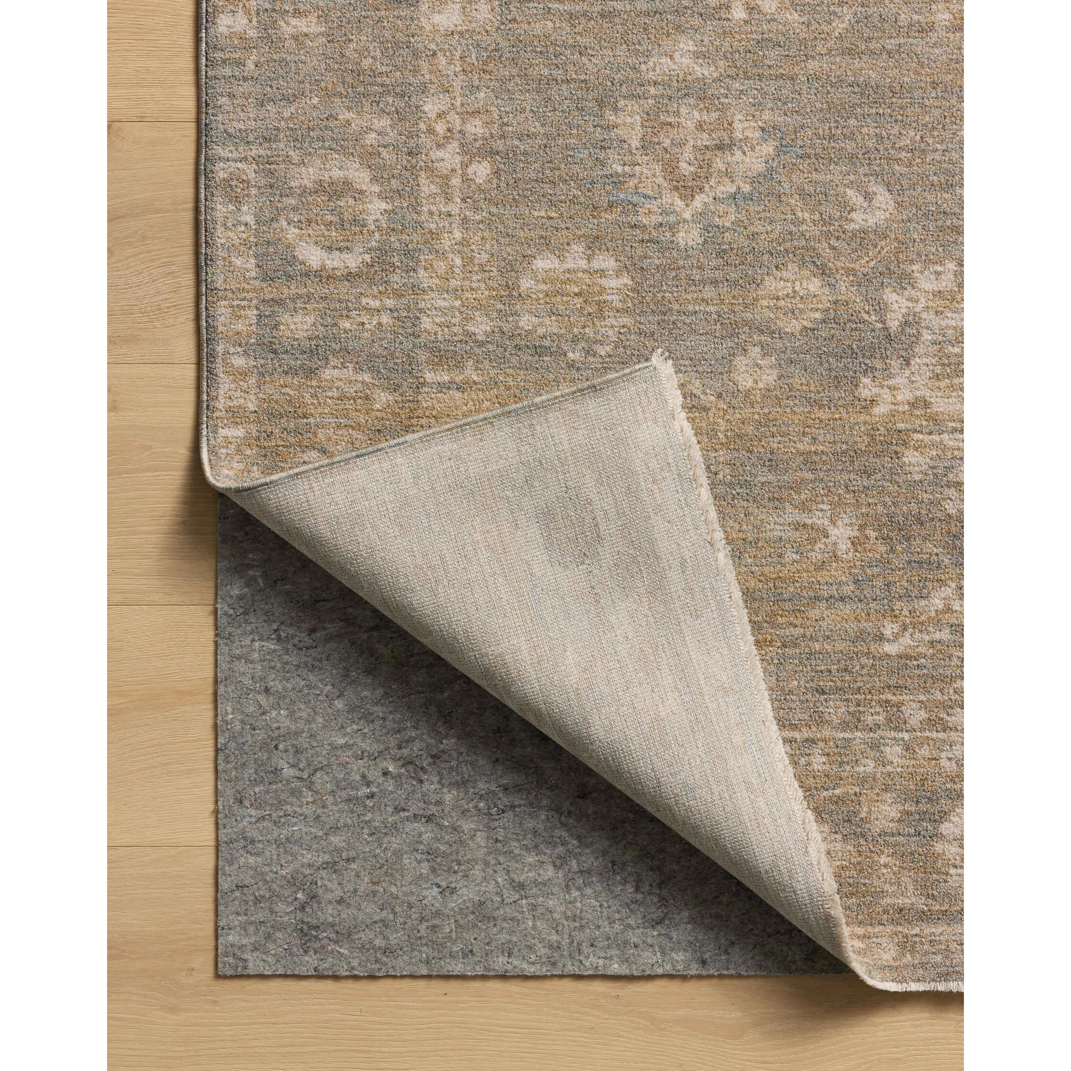 The Louisa Collection is a serene area rug based on beautiful, traditional Turkish designs updated in calm colorways by Chris Loves Julia in collaboration with Loloi. Pale blues, creams, and browns create a sense of softness, but so does the rugs pile, which is made of easy-to-clean, velvety polyester. Amethyst Home provides interior design, new home construction design consulting, vintage area rugs, and lighting in the Winter Garden metro area.