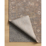 The Louisa Collection is a serene area rug based on beautiful, traditional Turkish designs updated in calm colorways by Chris Loves Julia in collaboration with Loloi. Pale blues, creams, and browns create a sense of softness, but so does the rugs pile, which is made of easy-to-clean, velvety polyester. Amethyst Home provides interior design, new home construction design consulting, vintage area rugs, and lighting in the Dallas metro area.