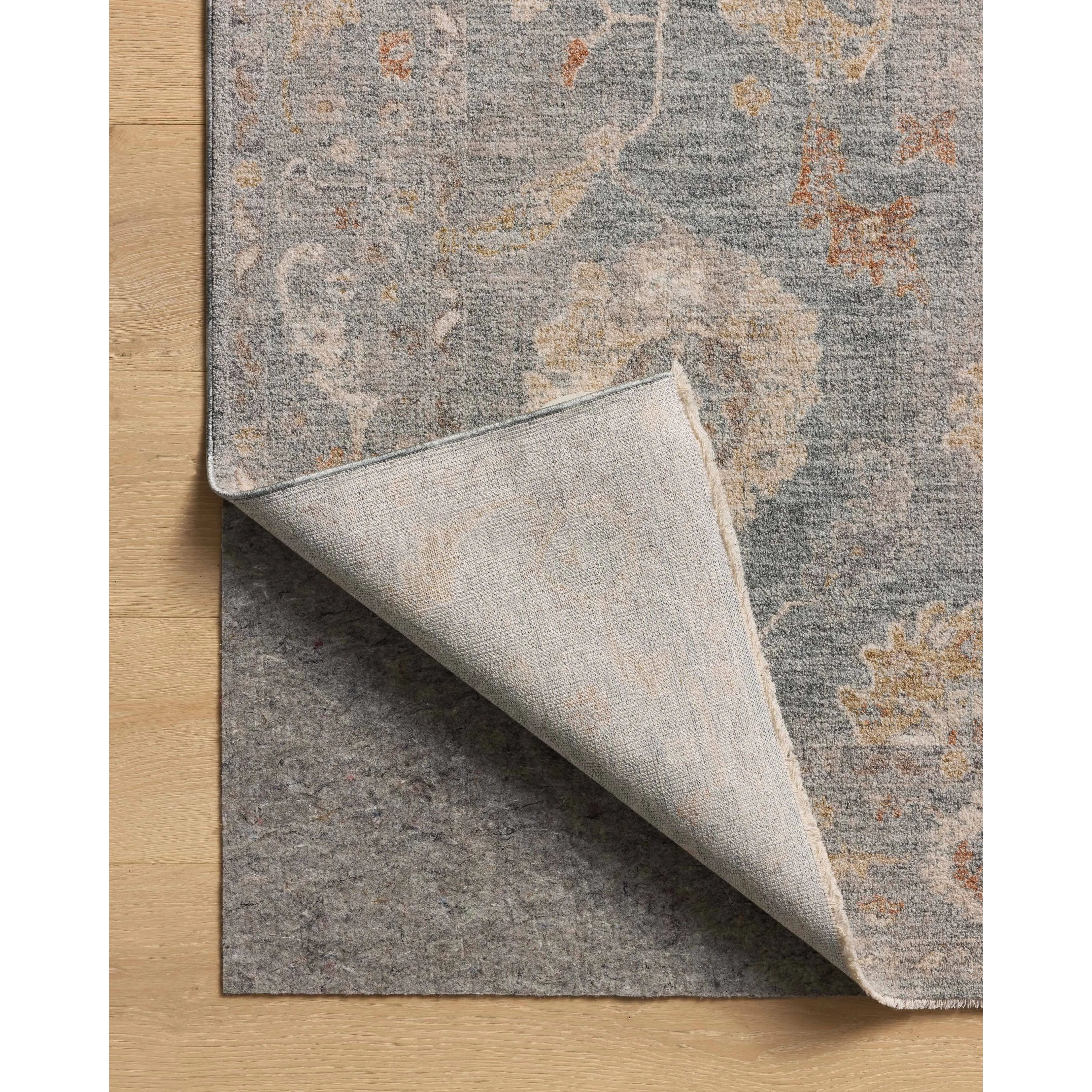 The Louisa Collection is a serene area rug based on beautiful, traditional Turkish designs updated in calm colorways by Chris Loves Julia in collaboration with Loloi. Pale blues, creams, and browns create a sense of softness, but so does the rugs pile, which is made of easy-to-clean, velvety polyester. Amethyst Home provides interior design, new home construction design consulting, vintage area rugs, and lighting in the Salt Lake City metro area.