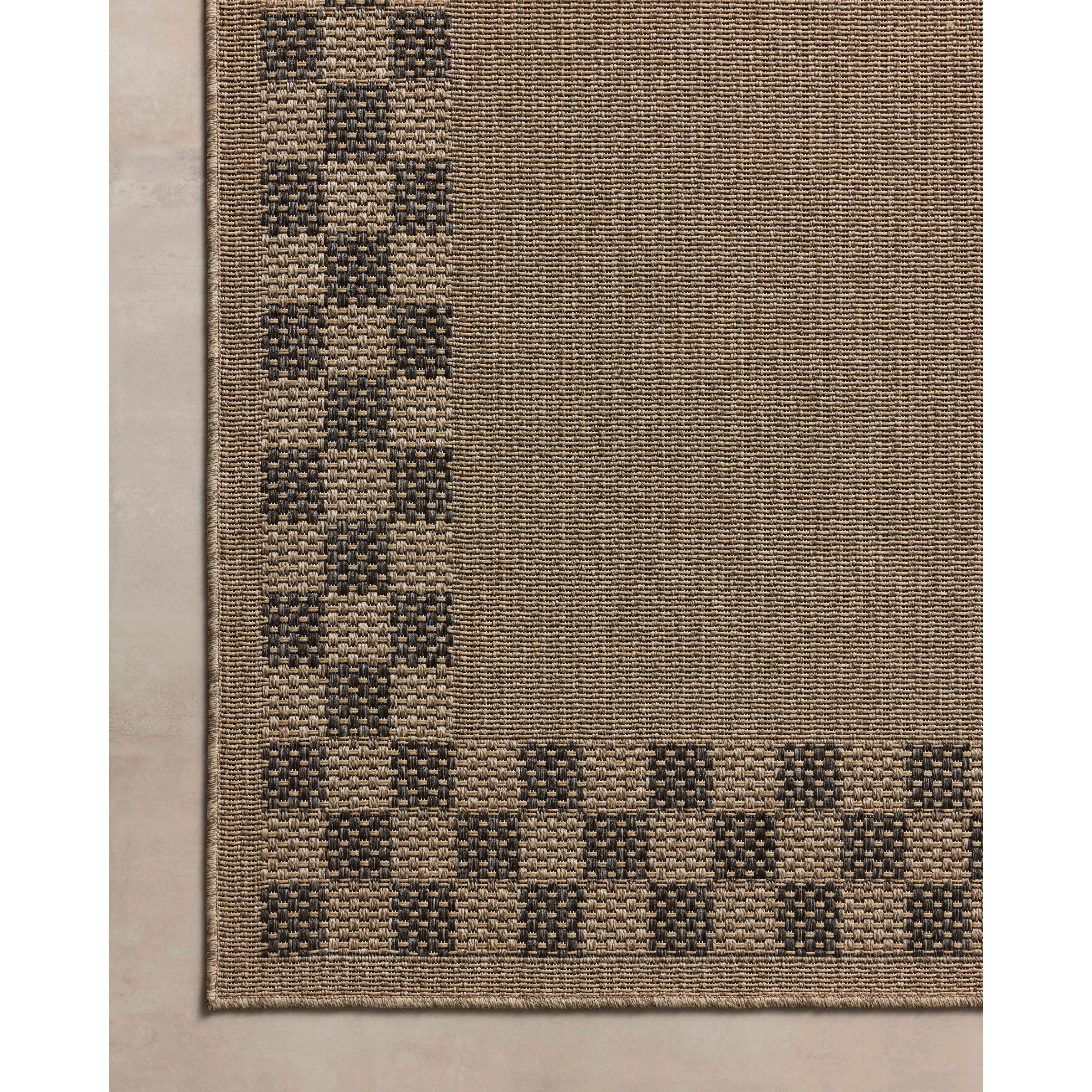 The Providence Collection is an indoor/outdoor rug with a woven-style design by Chris Loves Julia x Loloi. Providence is made of extra durable power-loomed polyester for versatile styling in patios, mudrooms, dining rooms, hallways, or more. Amethyst Home provides interior design, new home construction design consulting, vintage area rugs, and lighting in the Nashville metro area.