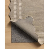 Featuring Chris Loves Julia × Loloi Scottie Fog / Ivory Rug by Loloi at Amethyst Home. The Scottie Collection from Chris Loves Julia x Loloi is a hand-tufted wool area rug with a playful scalloped edge and lower-pile, striped border for a touch of structure. The rugs overall pile is thick and plush, available in easygoing earth tones and neutral colorways. Thi. Amethyst Home provides interior design, new home construction design consulting, vintage area rugs, and lighting in the Austin metro area.