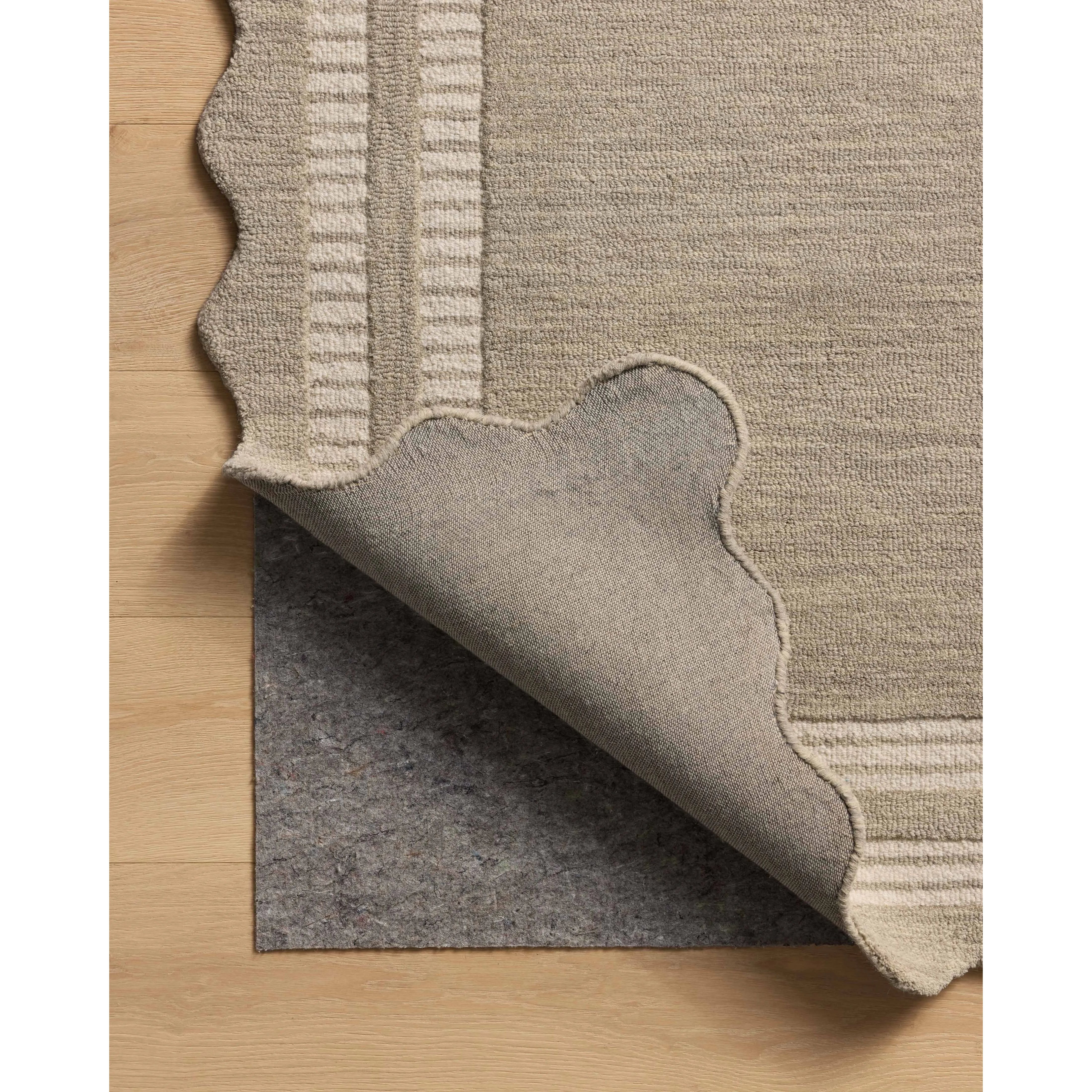 Featuring Chris Loves Julia × Loloi Scottie Fog / Ivory Rug by Loloi at Amethyst Home. The Scottie Collection from Chris Loves Julia x Loloi is a hand-tufted wool area rug with a playful scalloped edge and lower-pile, striped border for a touch of structure. The rugs overall pile is thick and plush, available in easygoing earth tones and neutral colorways. Thi. Amethyst Home provides interior design, new home construction design consulting, vintage area rugs, and lighting in the Austin metro area.