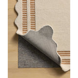 Featuring Chris Loves Julia × Loloi Scottie Ivory / Rust Rug by Loloi at Amethyst Home. The Scottie Collection from Chris Loves Julia x Loloi is a hand-tufted wool area rug with a playful scalloped edge and lower-pile, striped border for a touch of structure. The rugs overall pile is thick and plush, available in easygoing earth tones and neutral colorways. Th. Amethyst Home provides interior design, new home construction design consulting, vintage area rugs, and lighting in the Boston metro area.